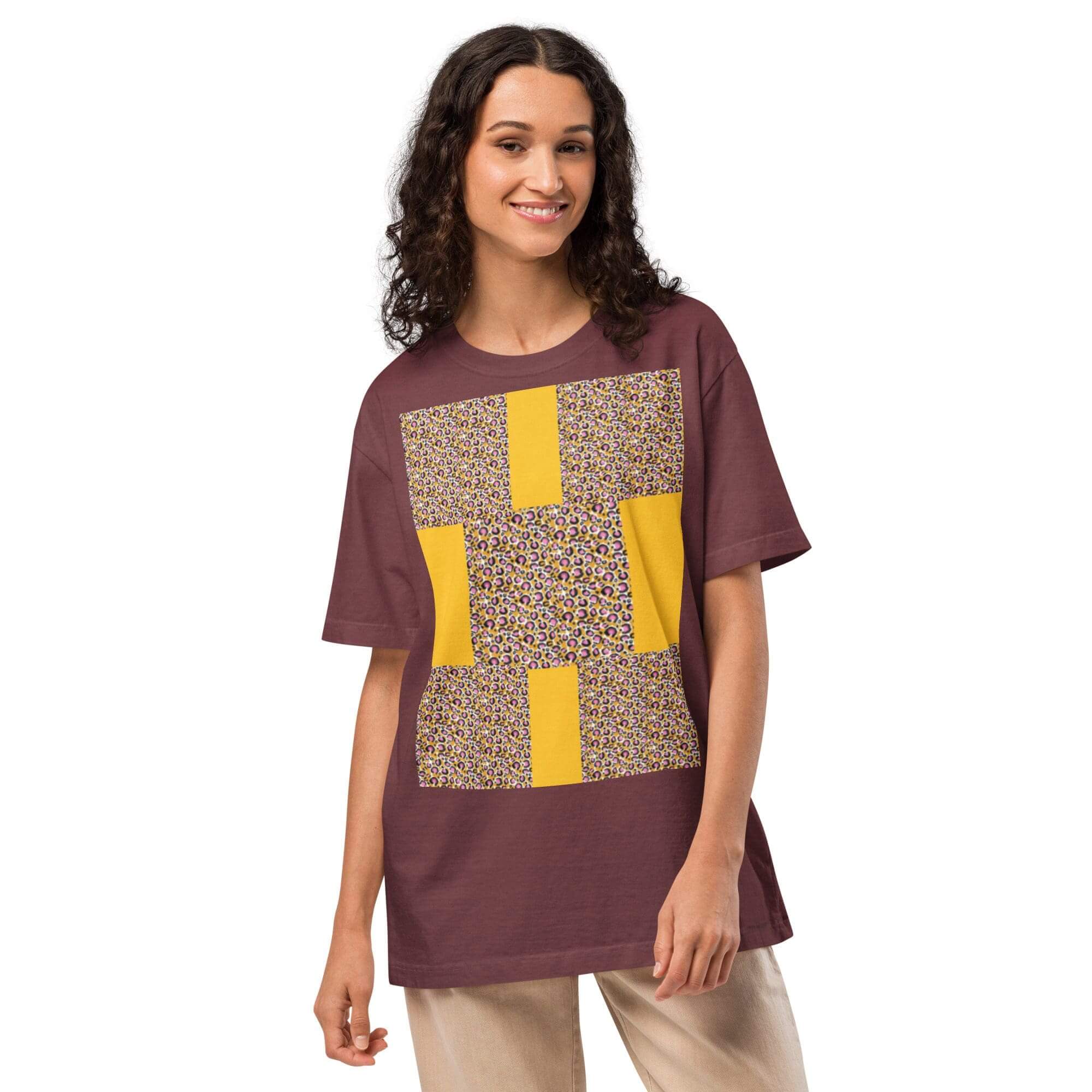 Woman wearing a patterned maroon t-shirt.