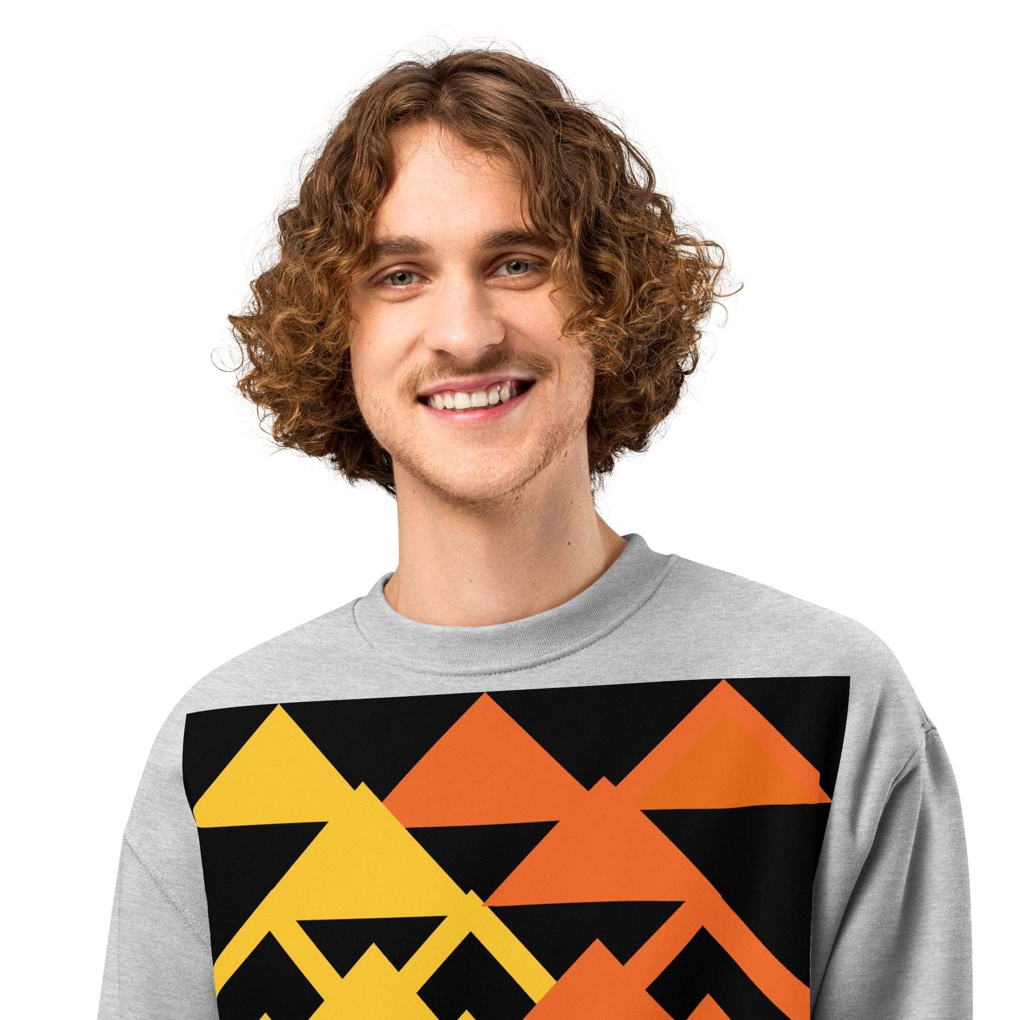Smiling person in gray sweatshirt with orange triangles