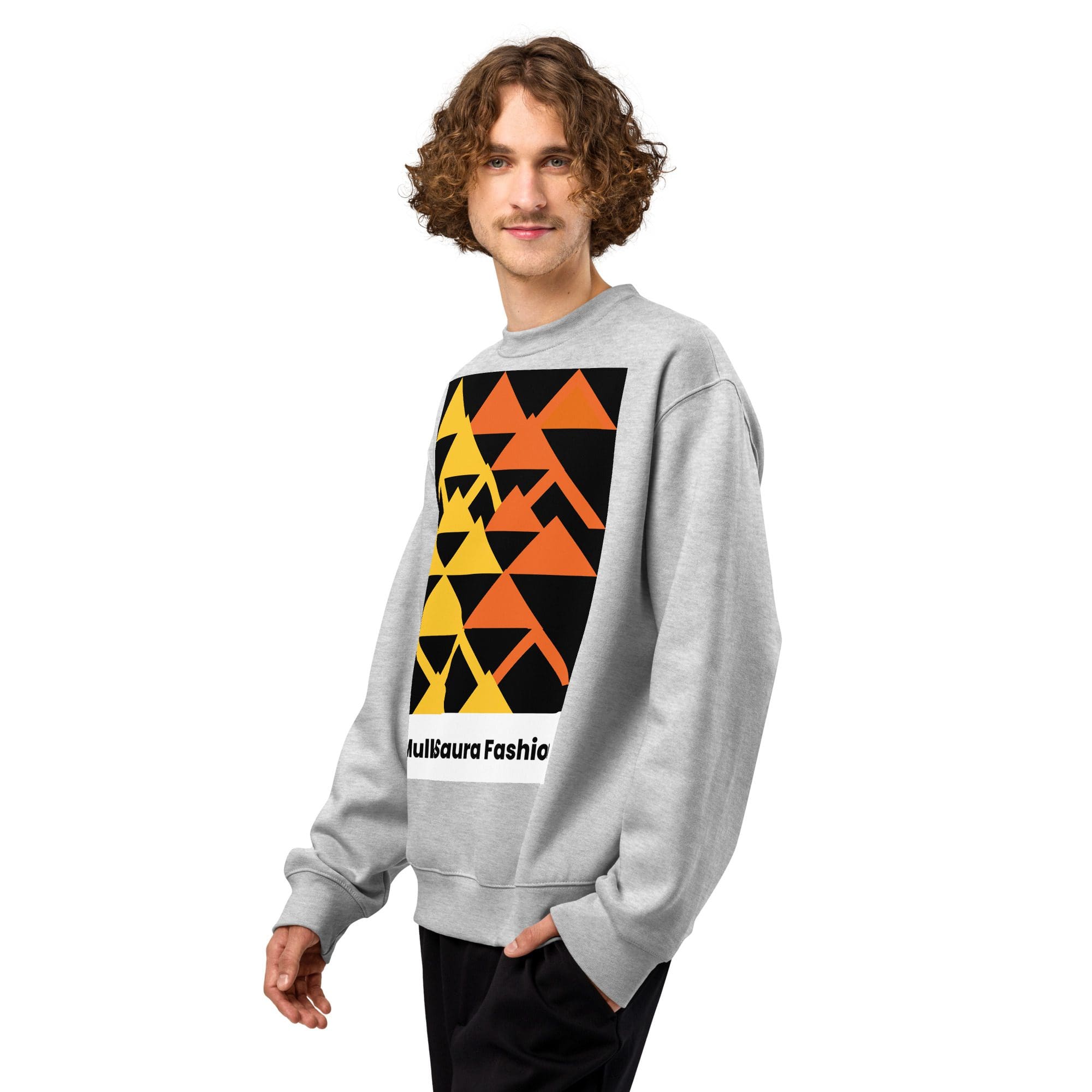 Person wearing geometric design sweatshirt, smiling.