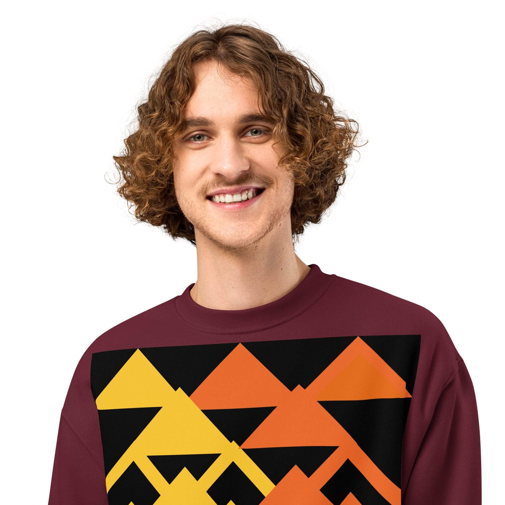 Smiling man wearing geometric patterned sweater