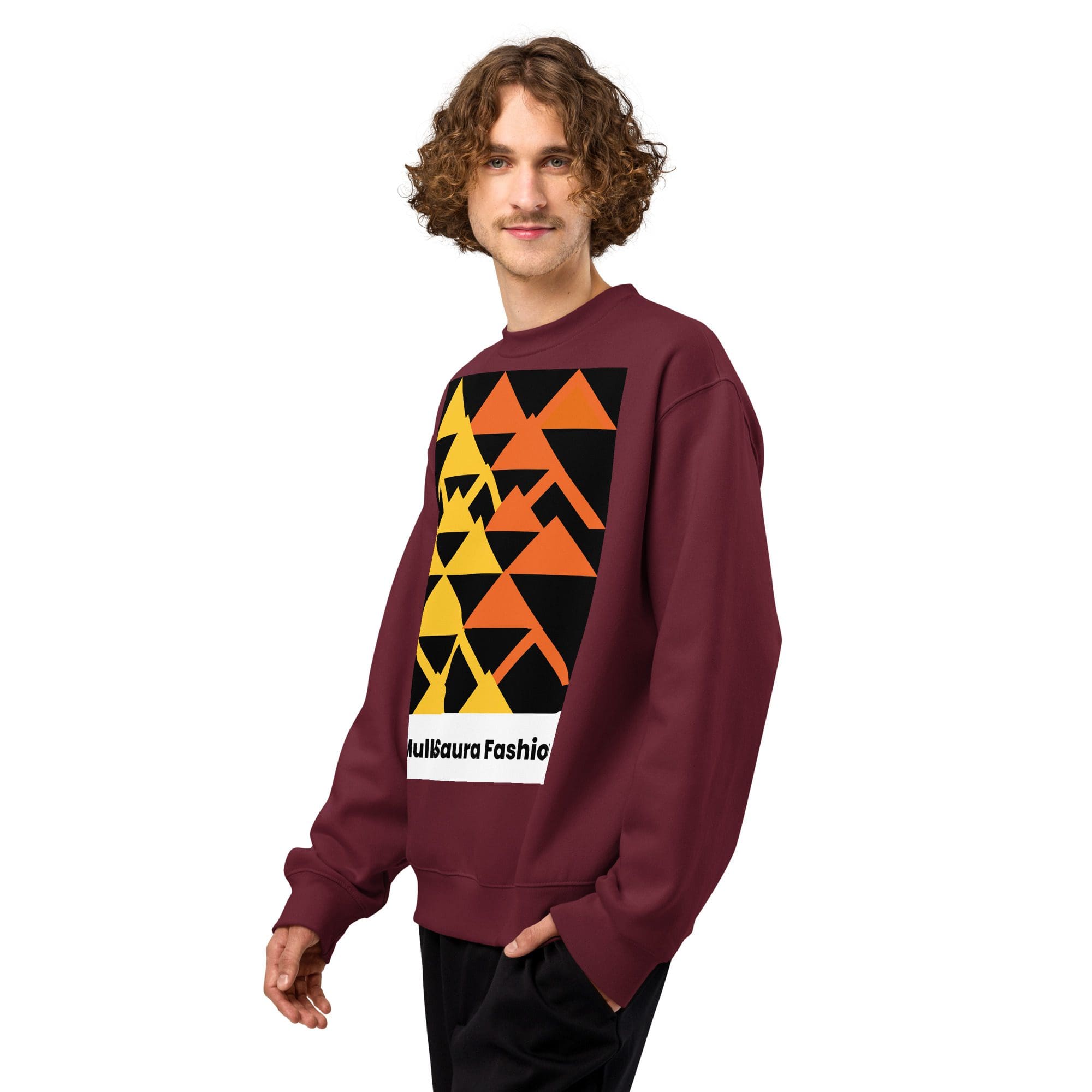 Person in geometric-patterned sweater smiling.