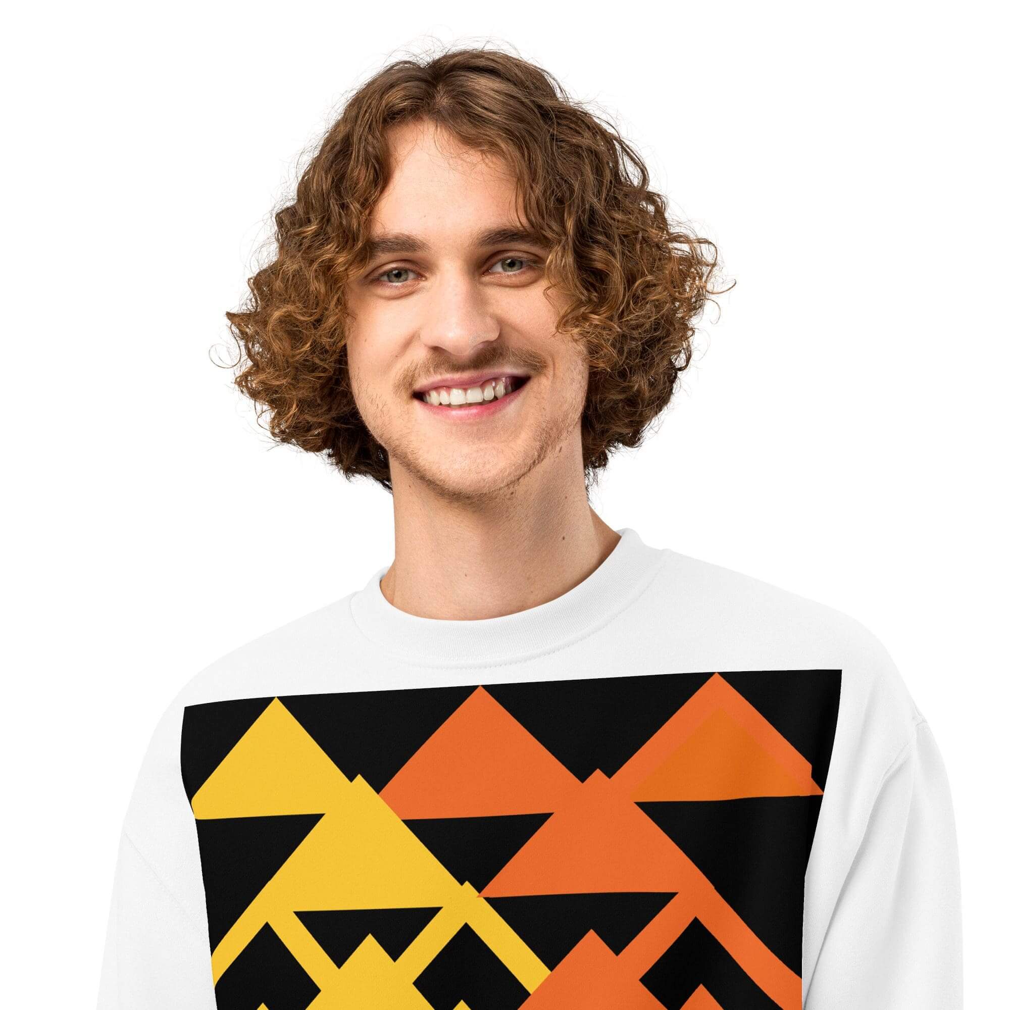Smiling person wearing geometric pattern sweater.