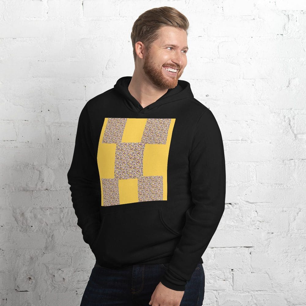 Smiling man in black hoodie with yellow design