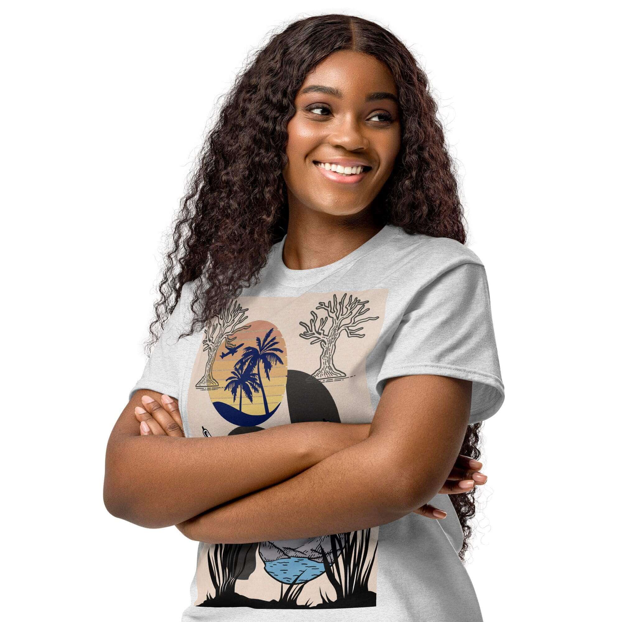 Smiling person wearing graphic t-shirt, arms crossed