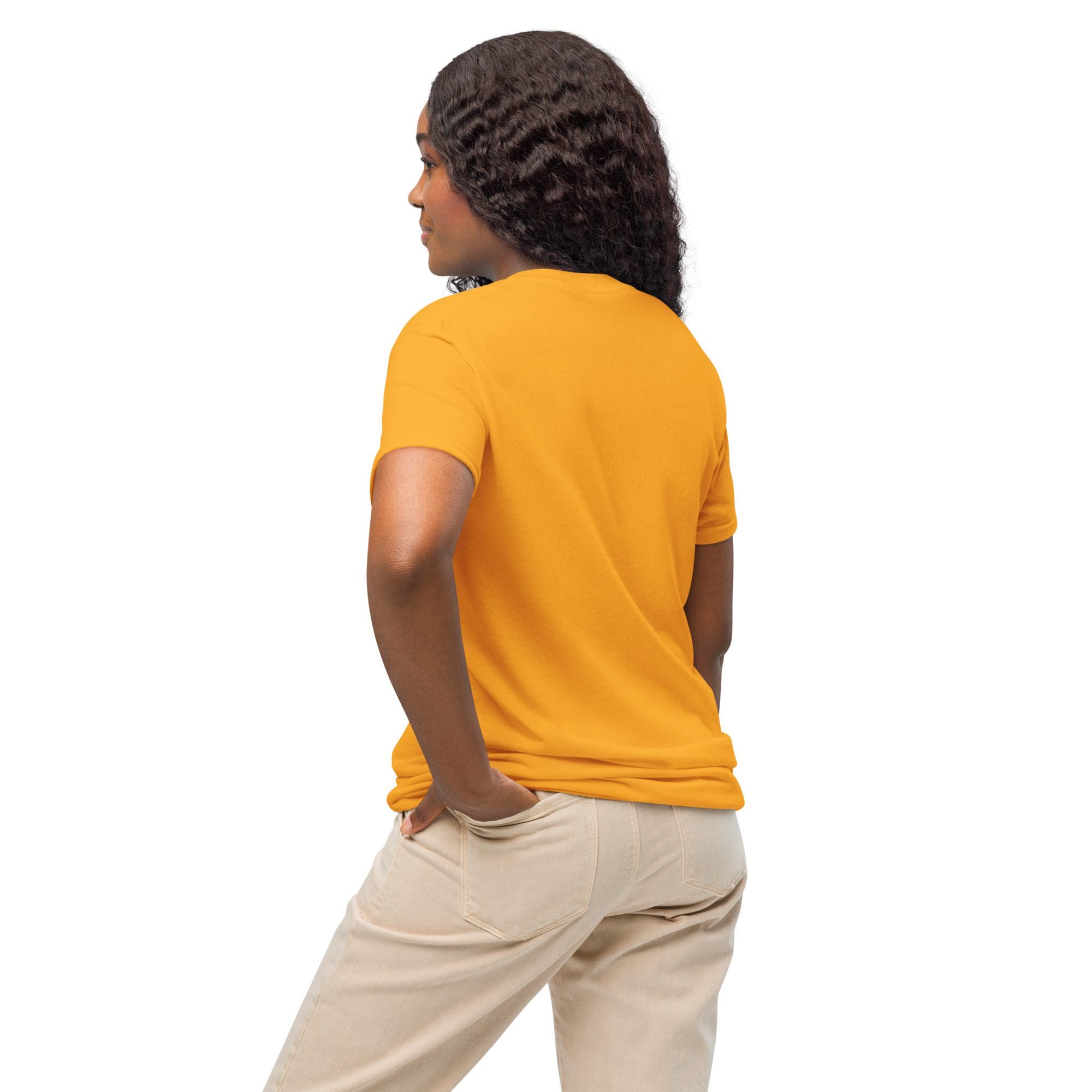 Person in orange shirt and beige pants.
