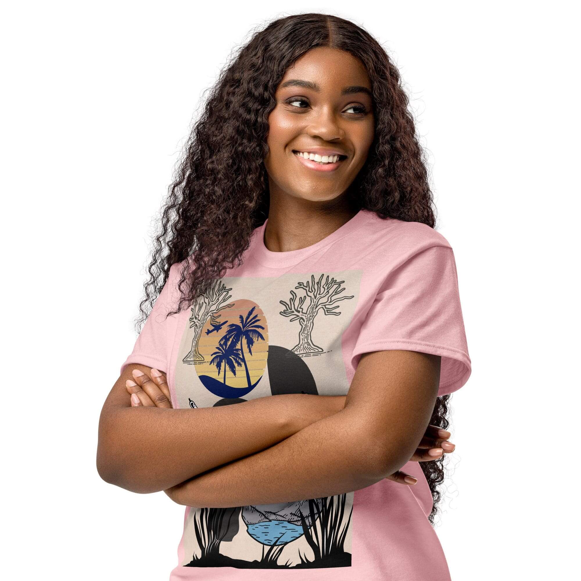 Smiling woman with crossed arms in graphic tee