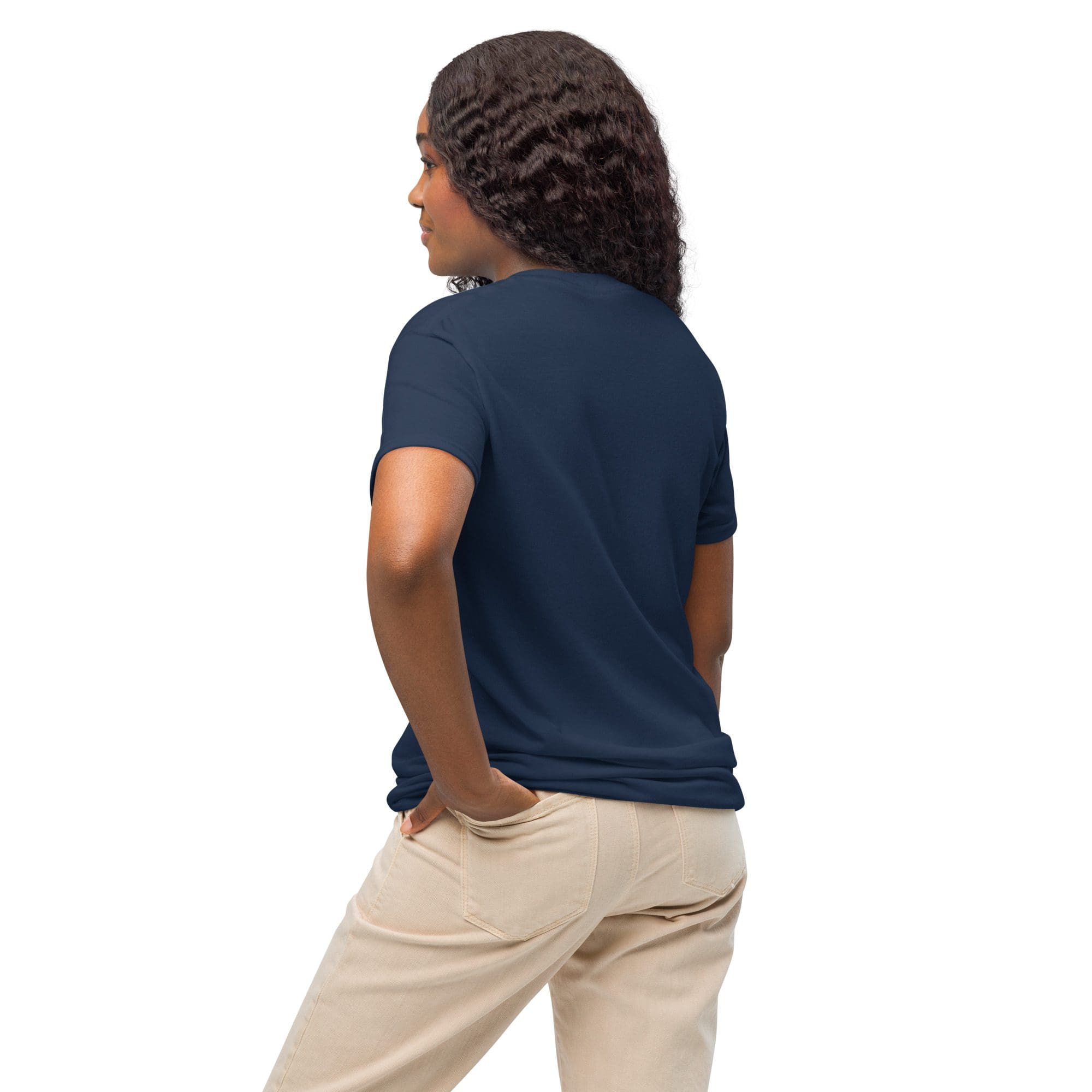 Woman in navy shirt and beige pants.