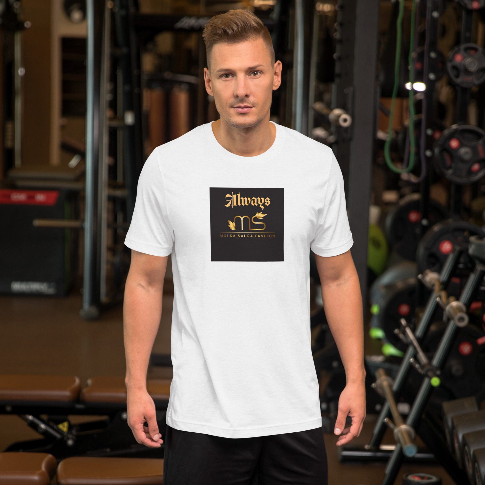 Man in gym wearing white graphic t-shirt.