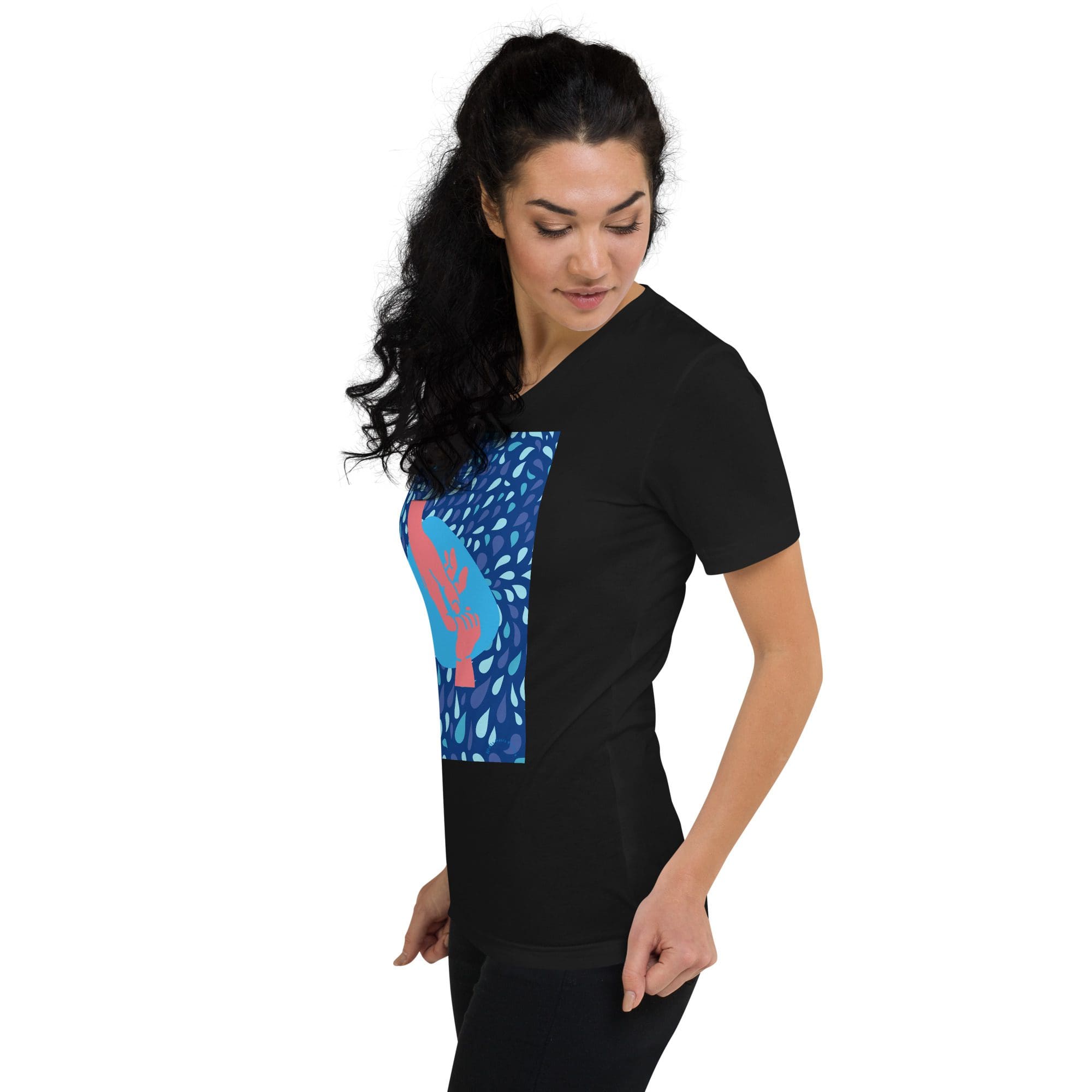 Woman modeling black tee with blue graphic