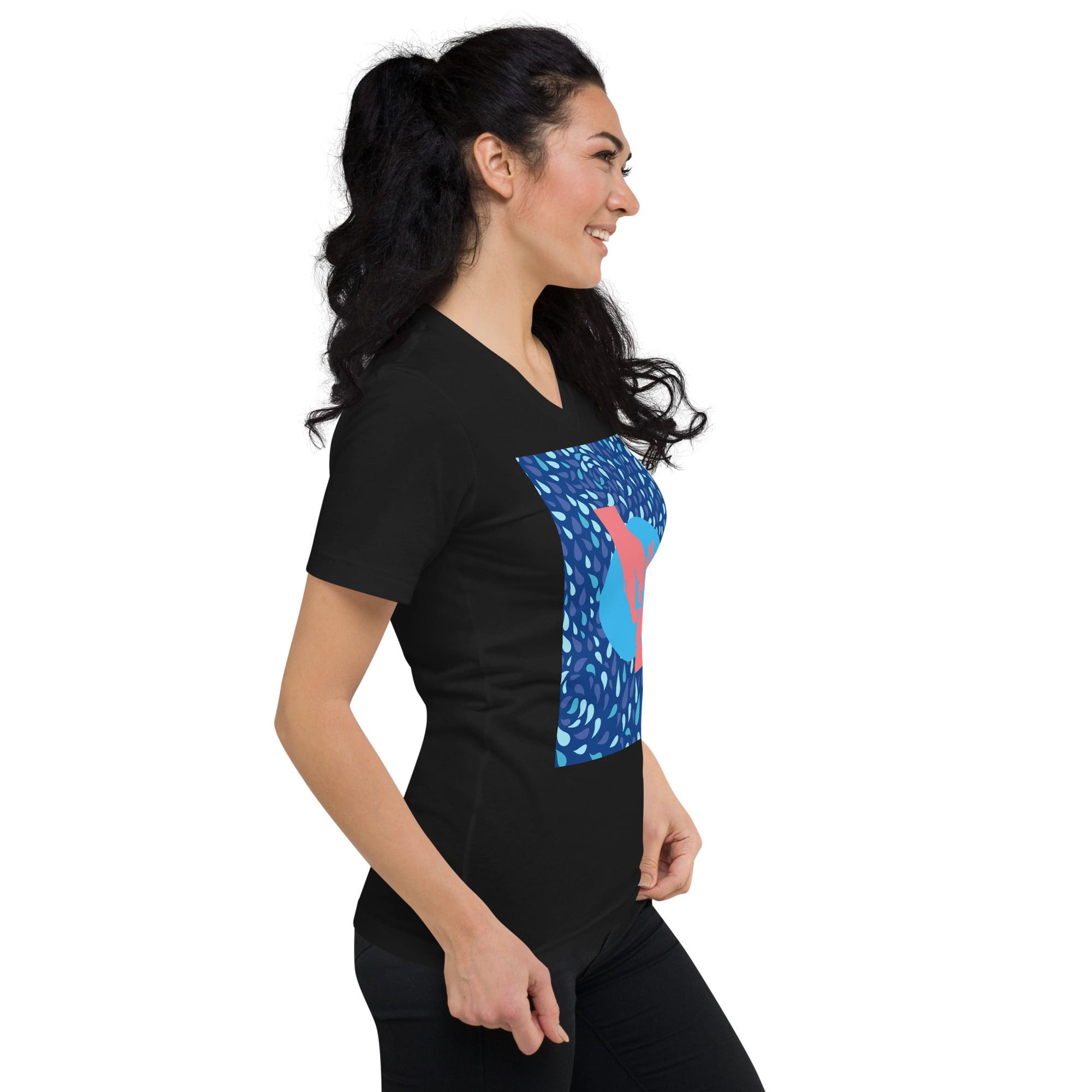 Smiling woman in black tee with blue design
