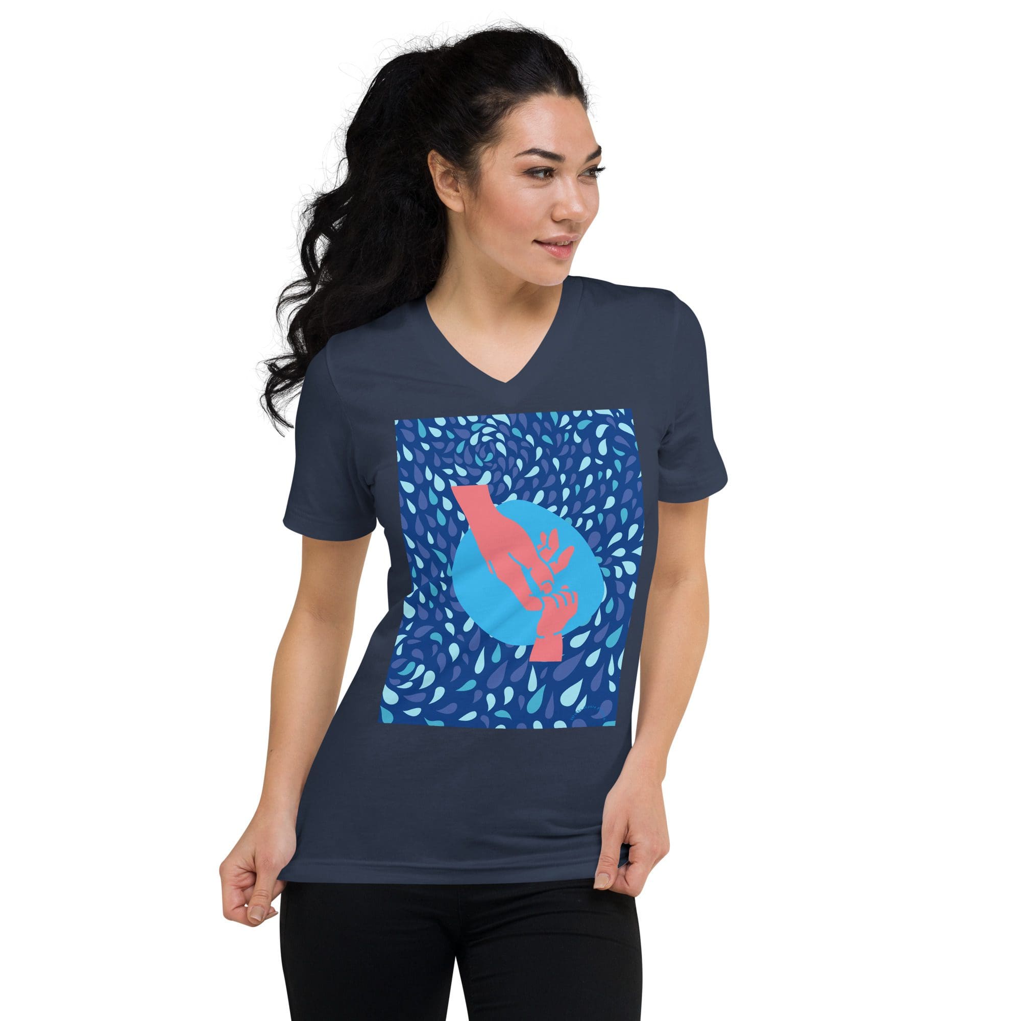 Woman wearing blue graphic t-shirt, smiling.