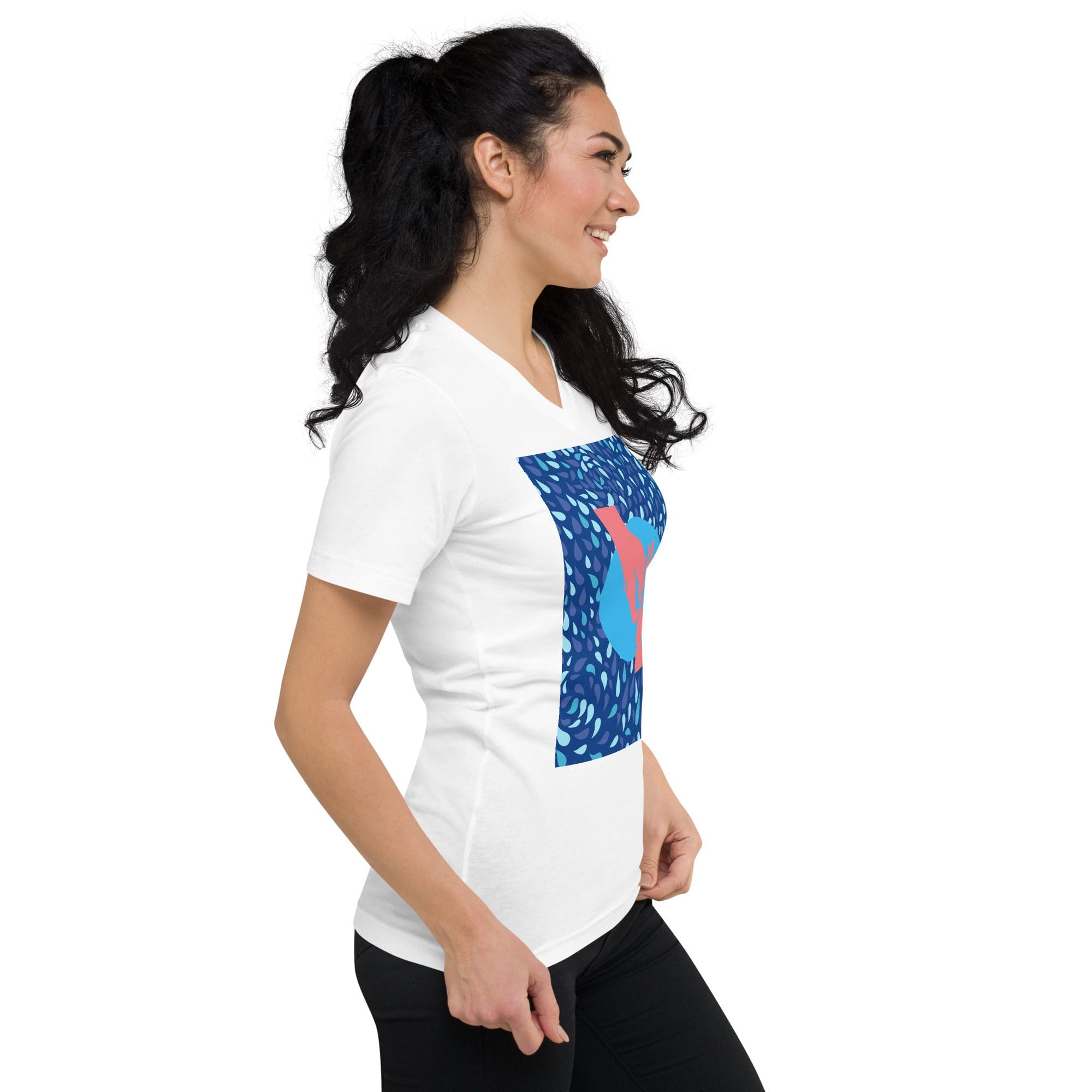 Woman wearing a white graphic t-shirt.