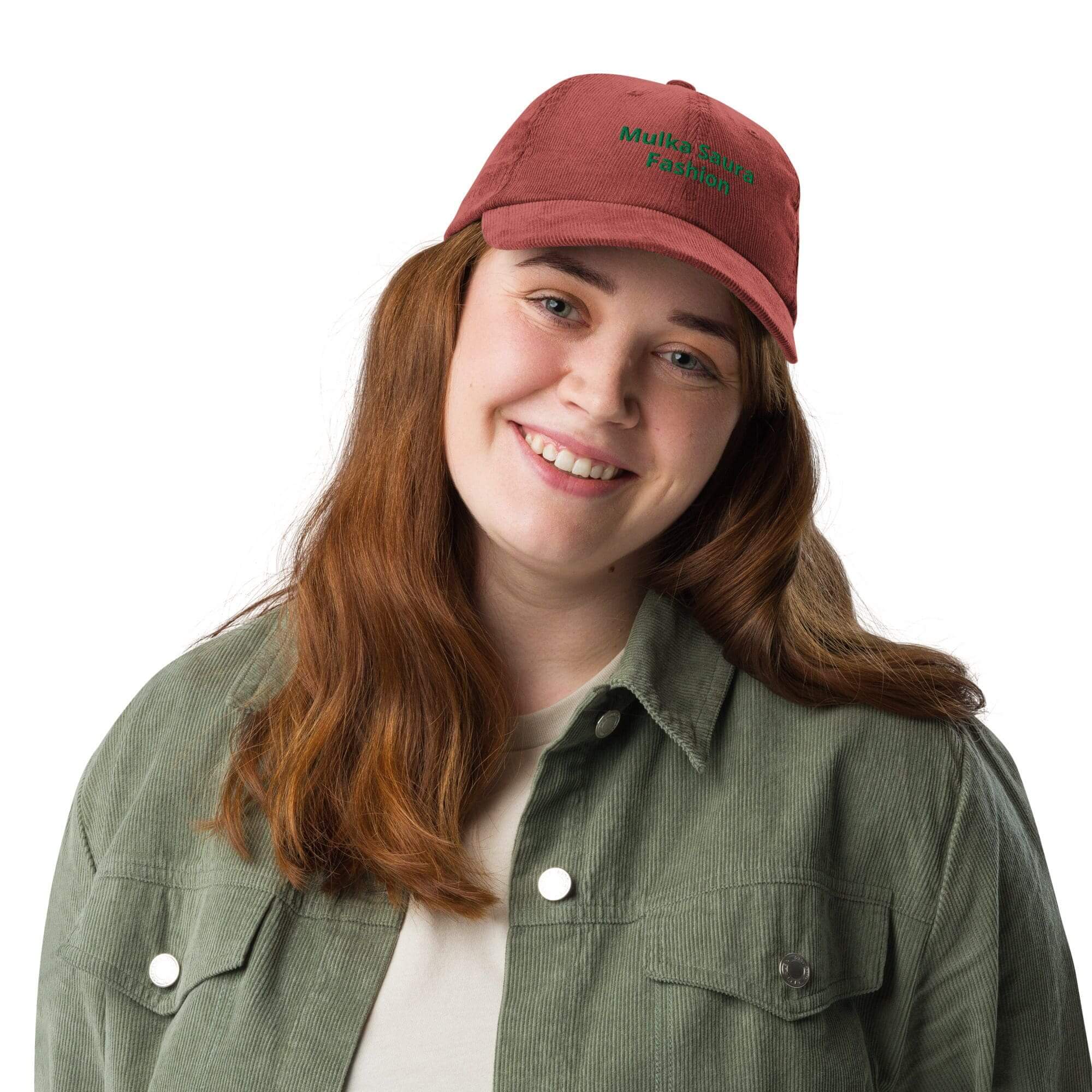 Smiling person wearing red cap and jacket.