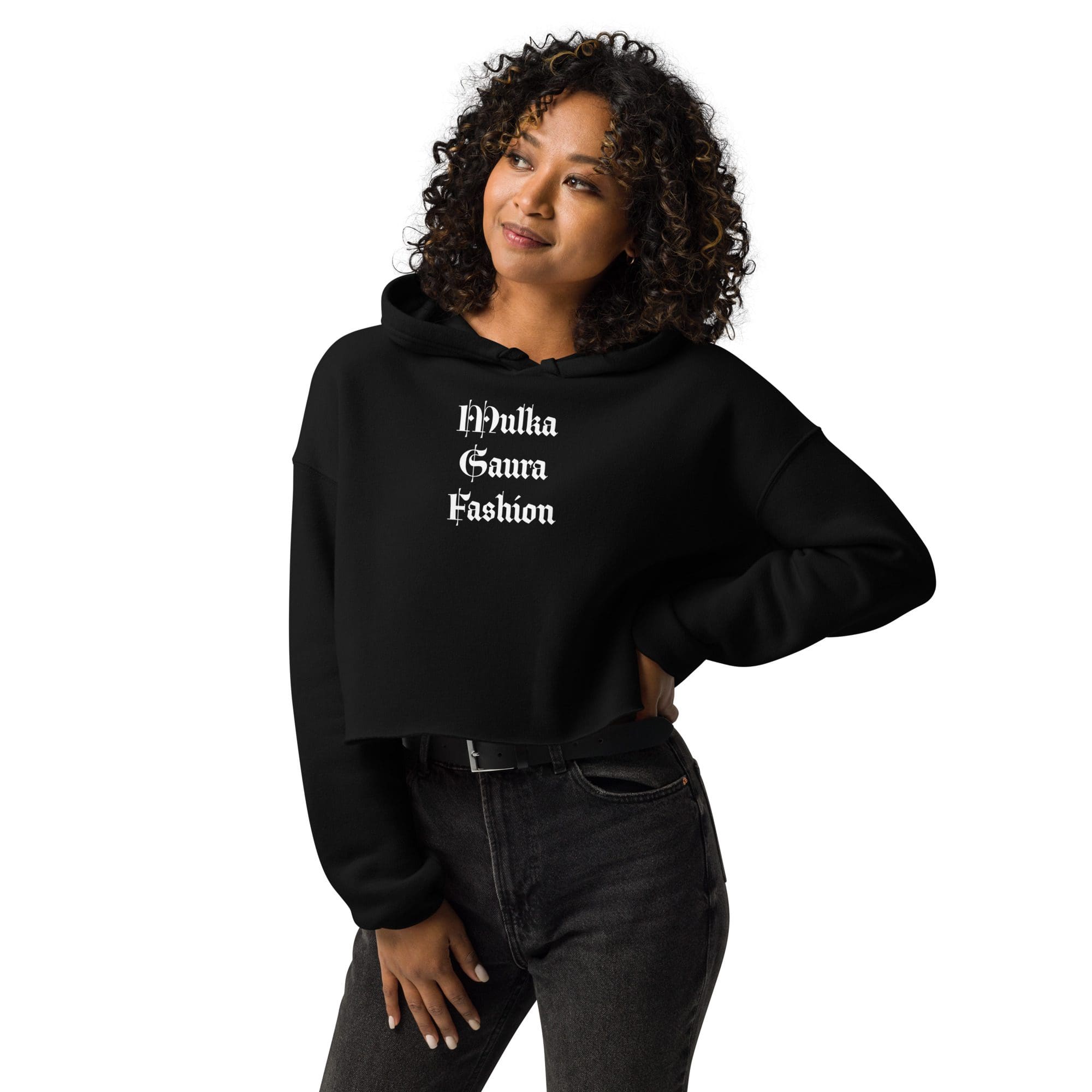 Woman in black hoodie smiling confidently.