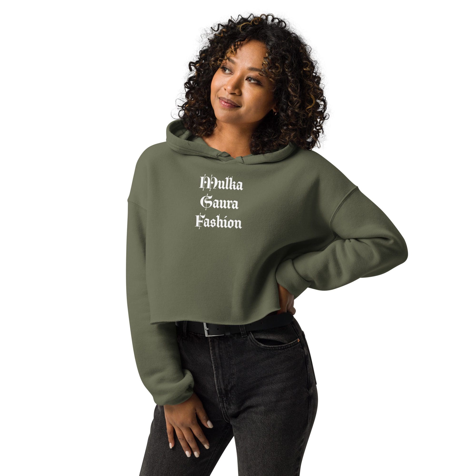 Woman in green cropped hoodie smiling.