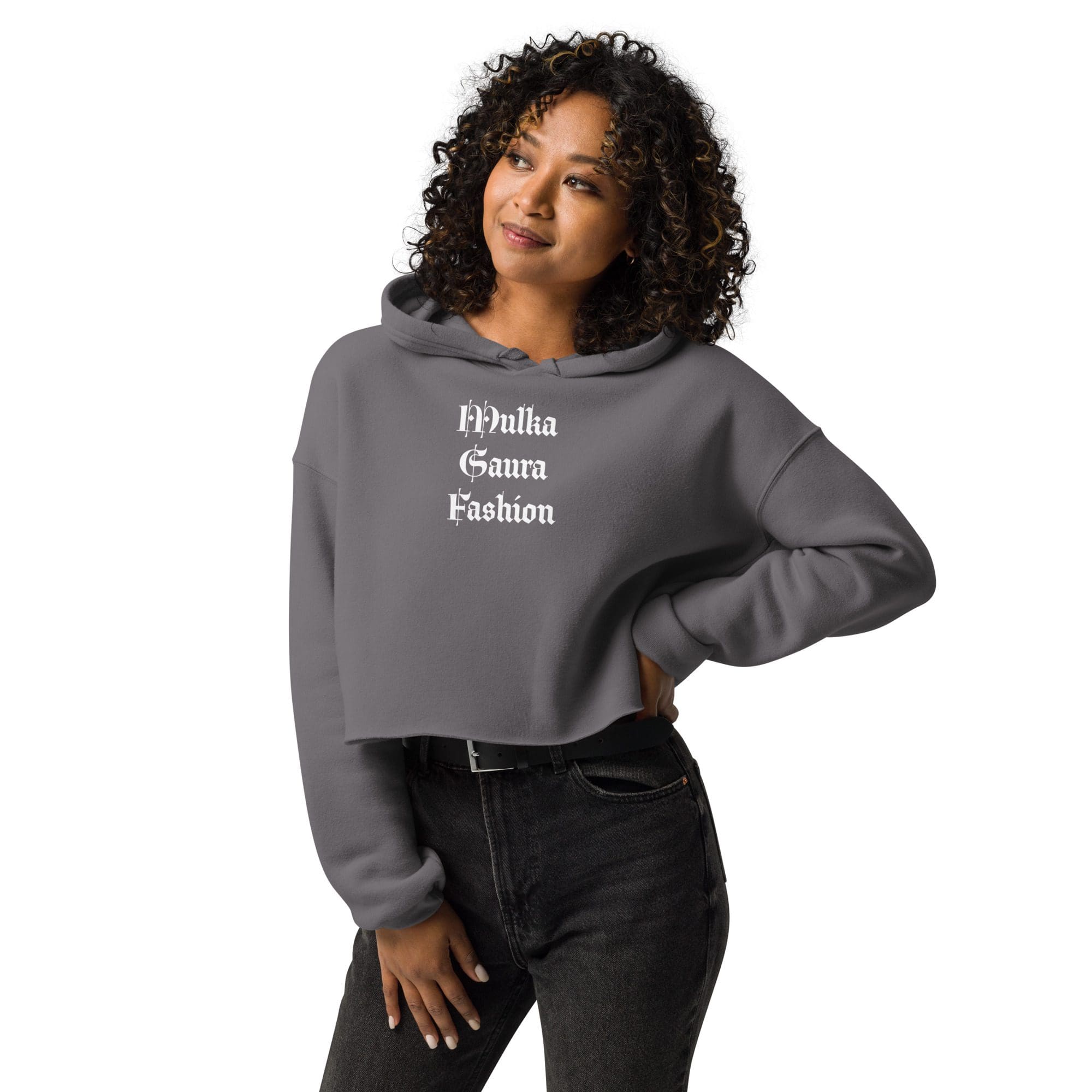Woman in gray cropped hoodie, smiling confidently.