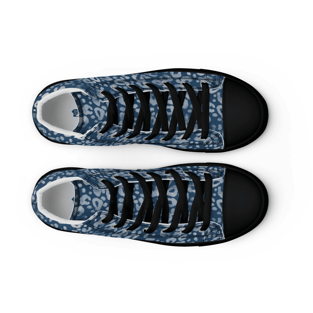 Blue patterned sneakers on black background.