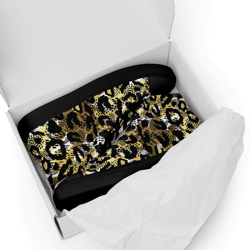 Leopard print boots in white shoe box.