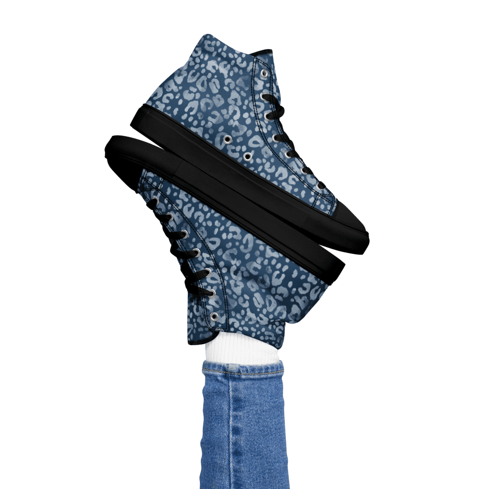 Blue patterned sneakers with denim jeans.
