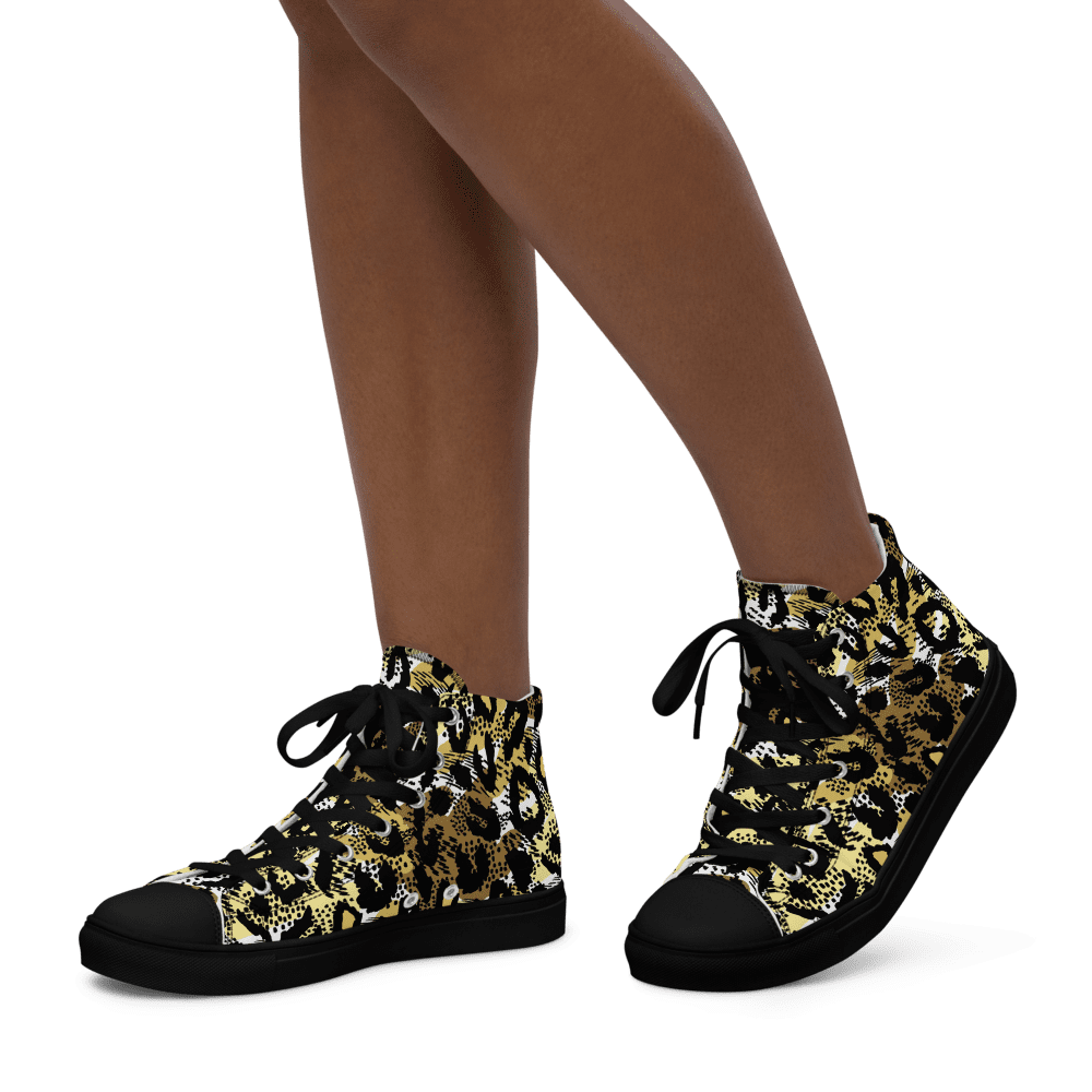 Legs wearing leopard print high-top sneakers.