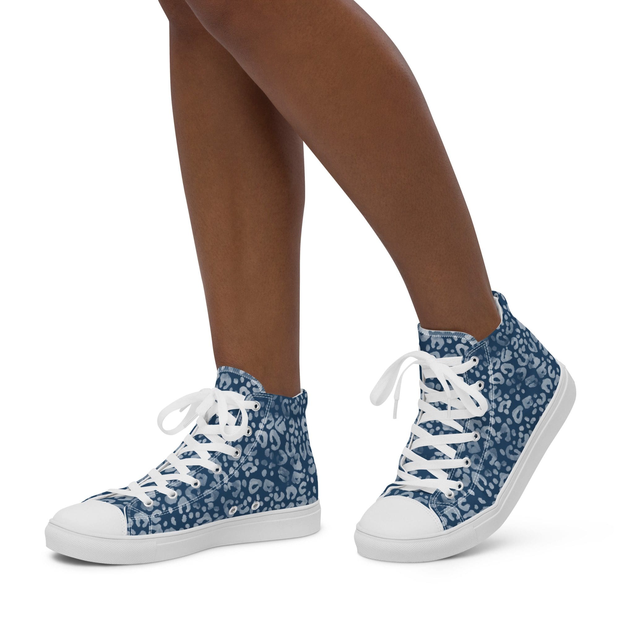 Legs wearing blue patterned high-top sneakers.