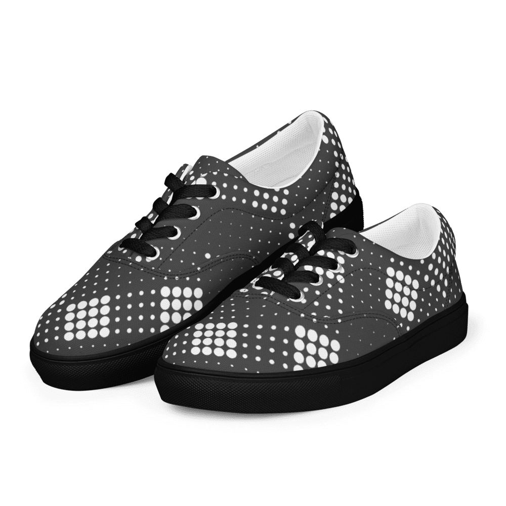 Black canvas sneakers with white polka dots