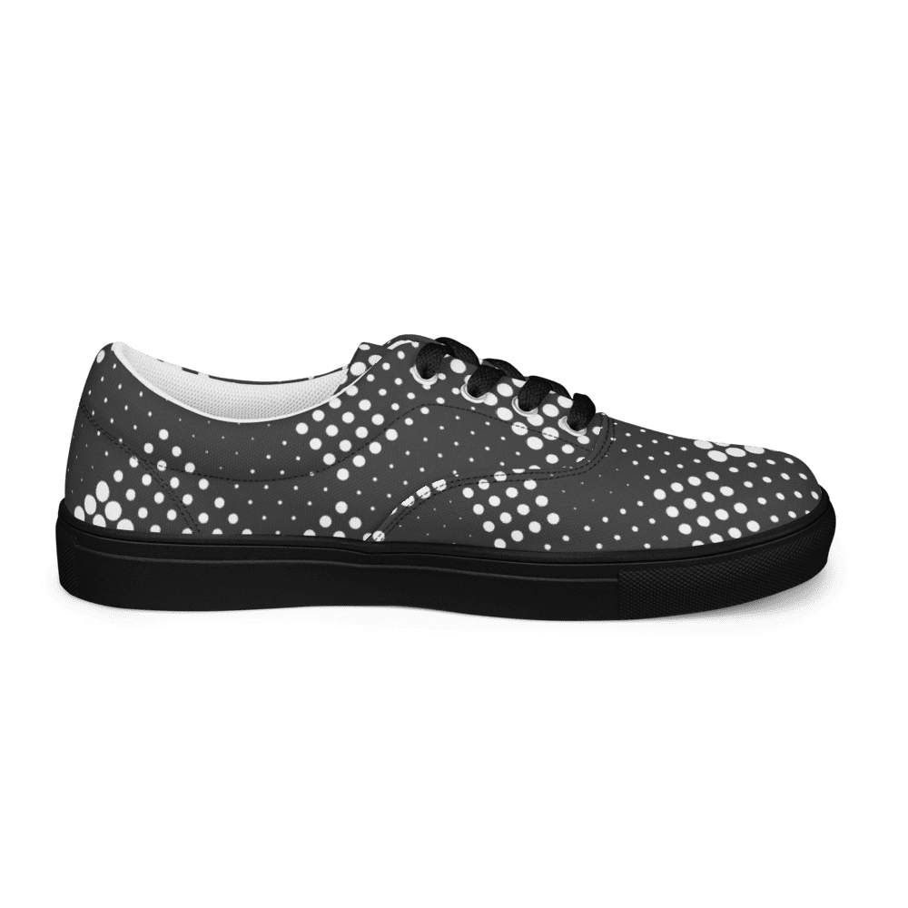 Black sneaker with white polka dot pattern.