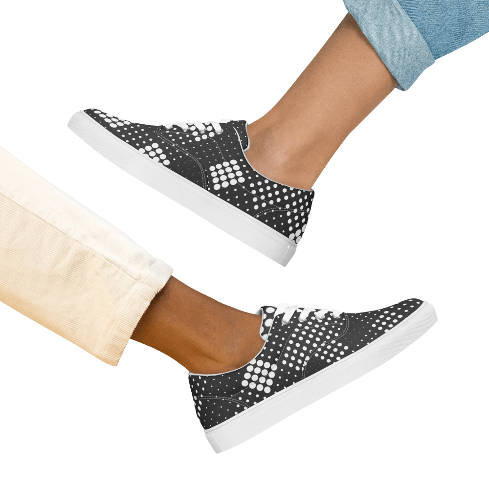 Pair of black sneakers with white dots