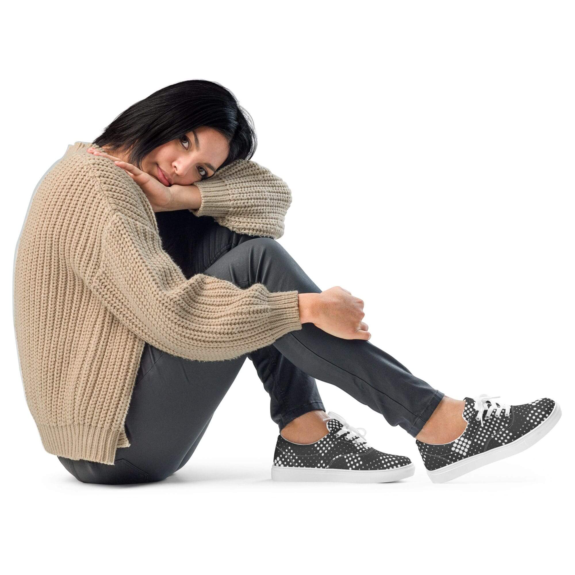 Woman in cozy sweater and polka dot shoes.