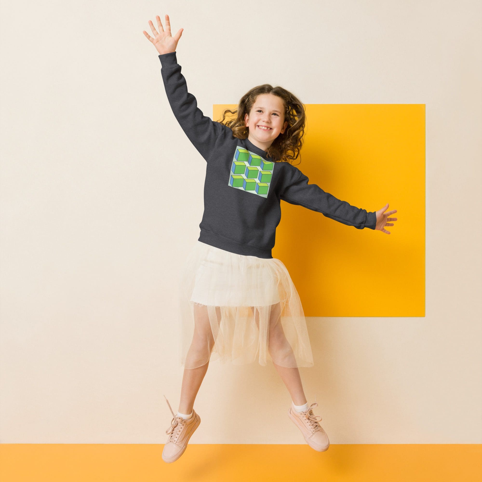 Girl jumping with arms raised, smiling brightly.