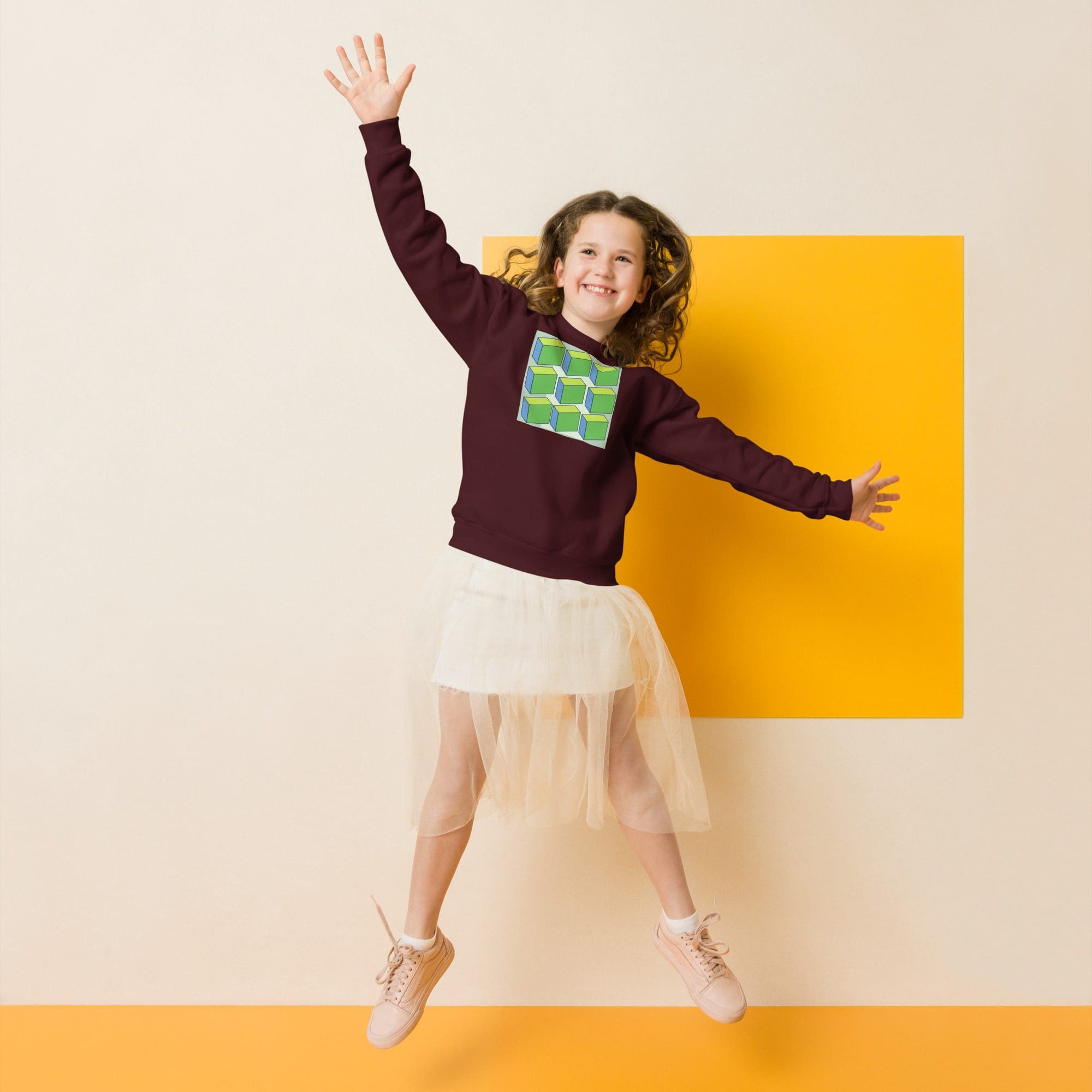 Girl jumping in colorful outfit, smiling.