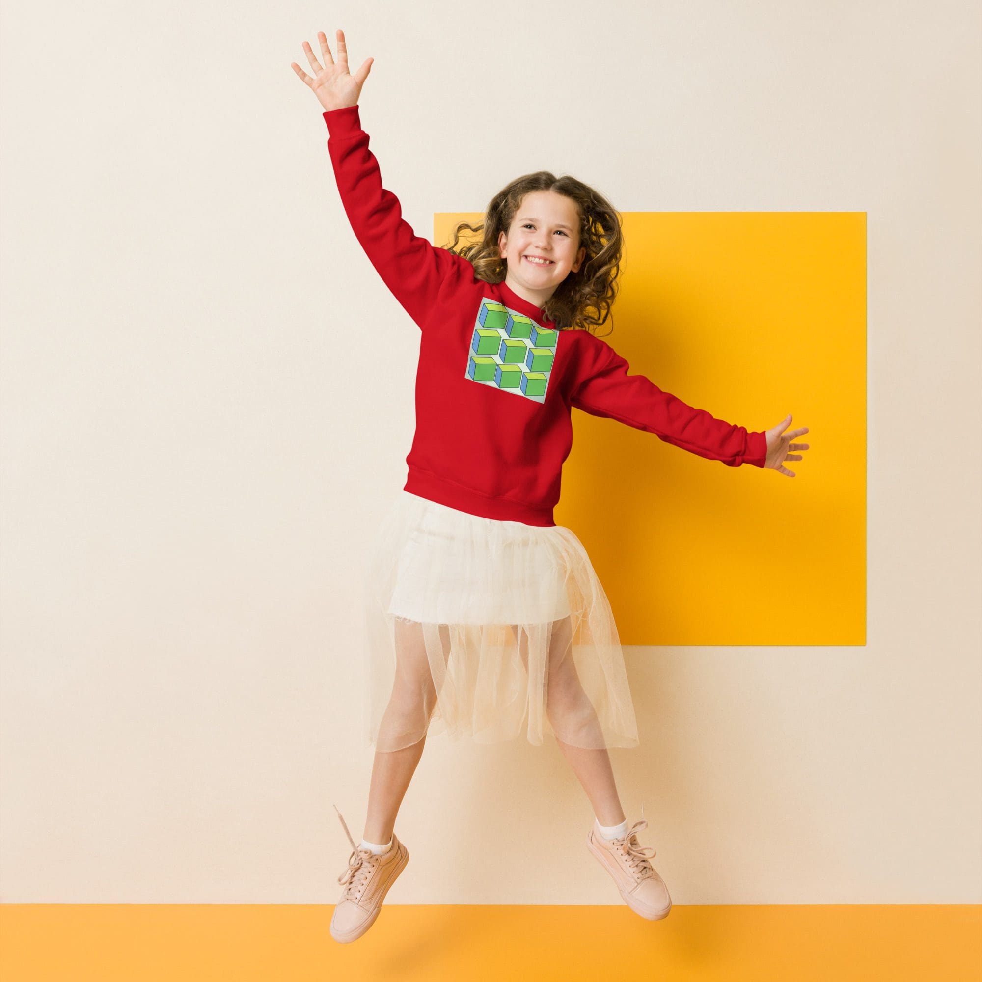 Girl jumping joyfully against yellow square background.