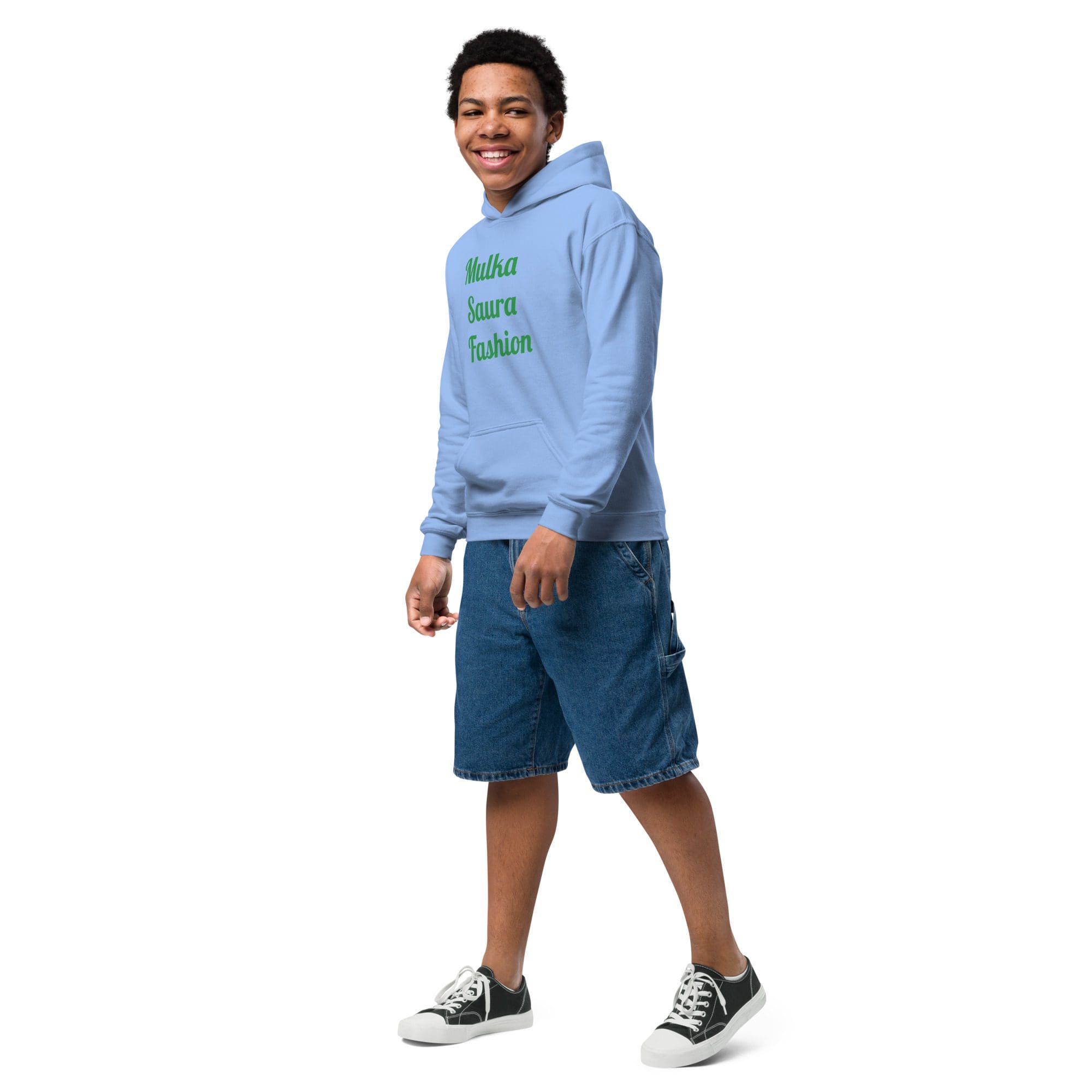 Smiling teen wearing blue hoodie and denim shorts