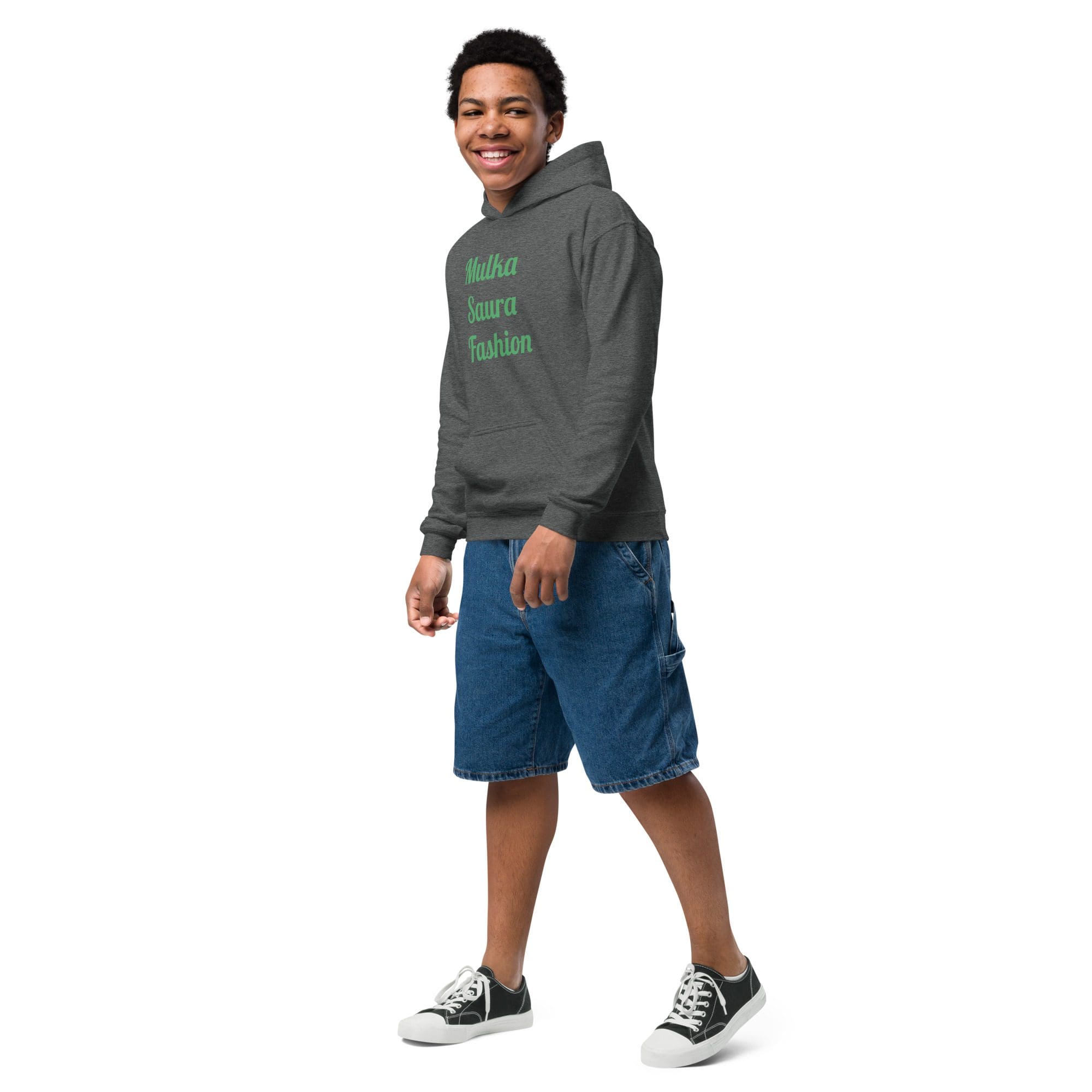 Smiling person wearing hoodie and denim shorts
