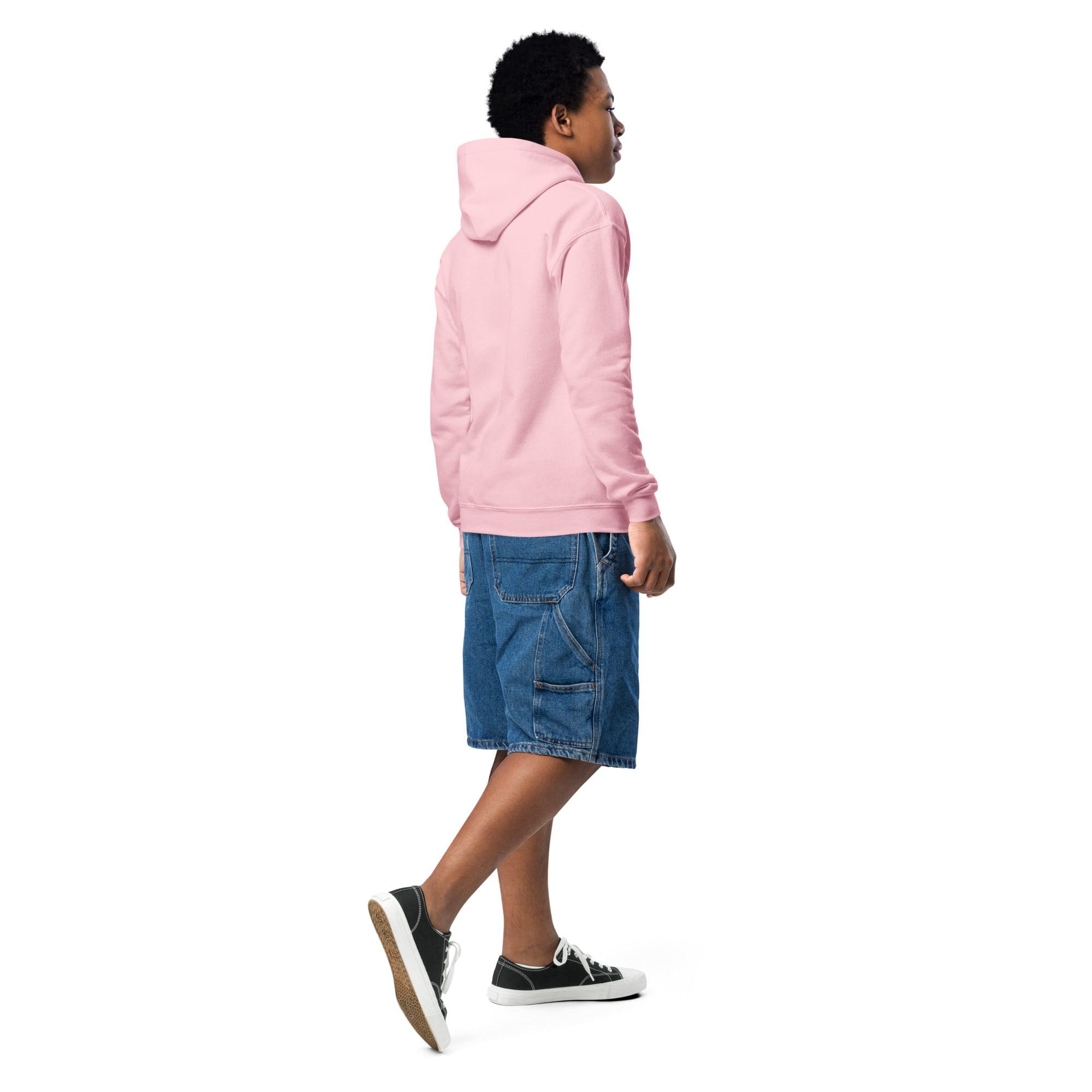 Person walking in pink hoodie and denim shorts