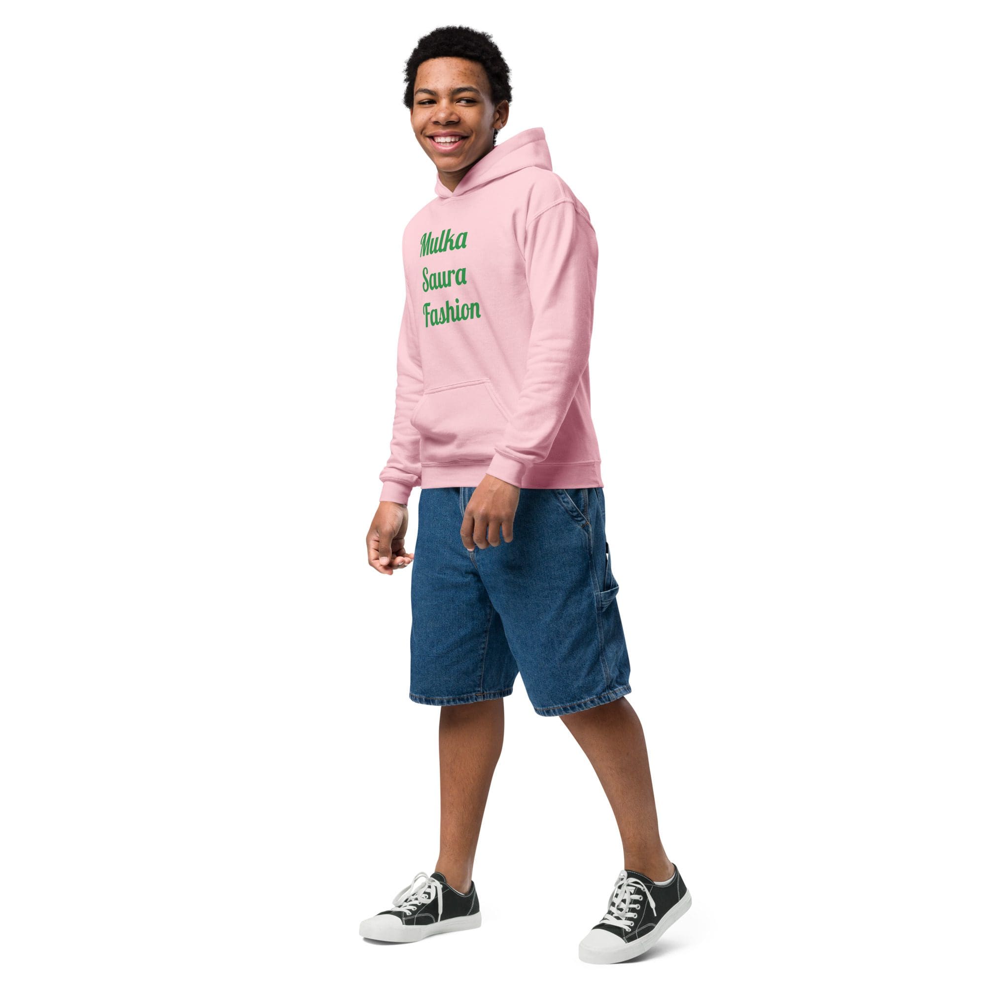 Person in pink hoodie and denim shorts.