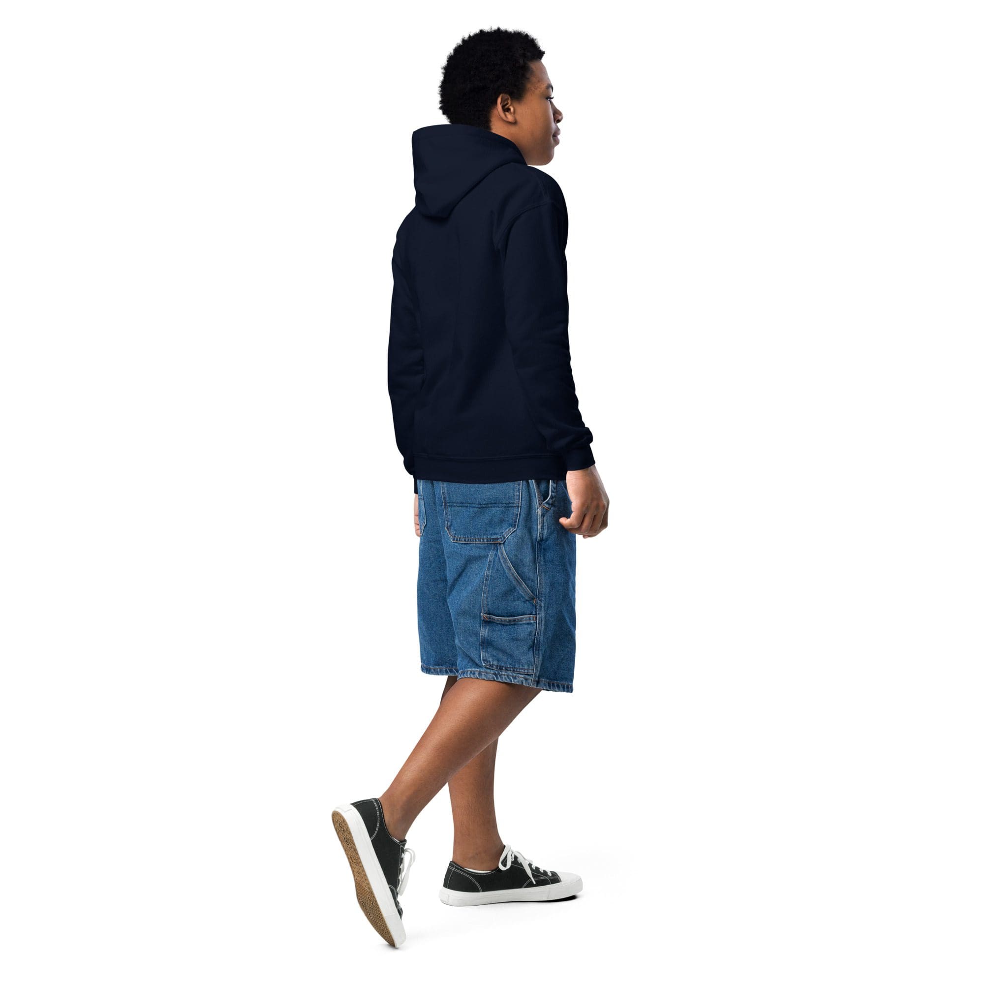 Person in navy hoodie and denim shorts walking