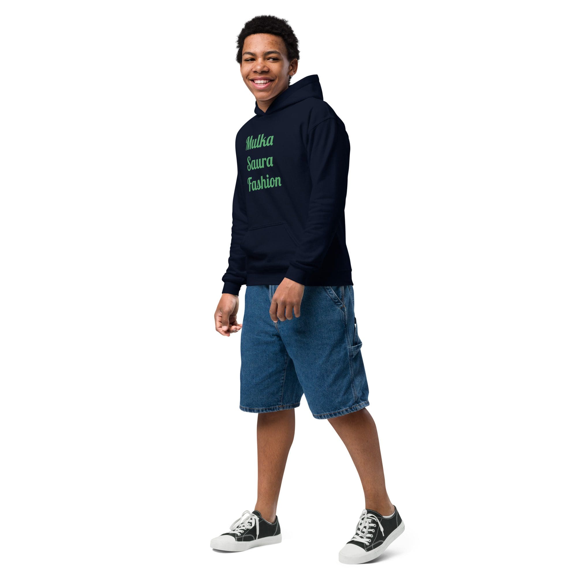 Smiling teen in casual hoodie and denim shorts