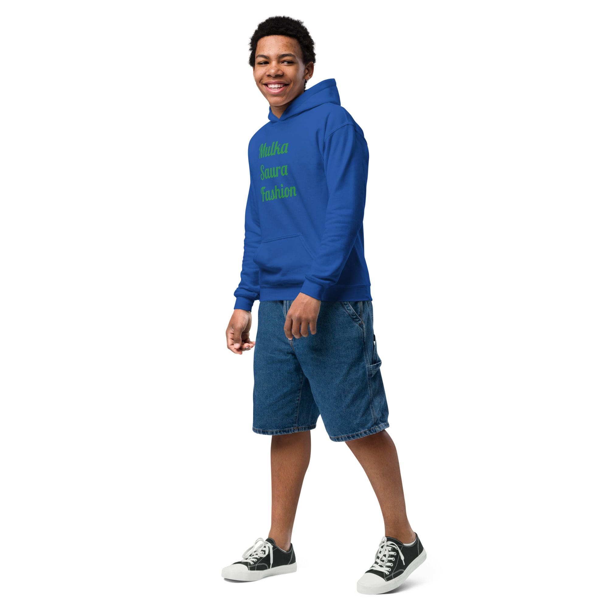 Smiling person in blue hoodie and shorts.