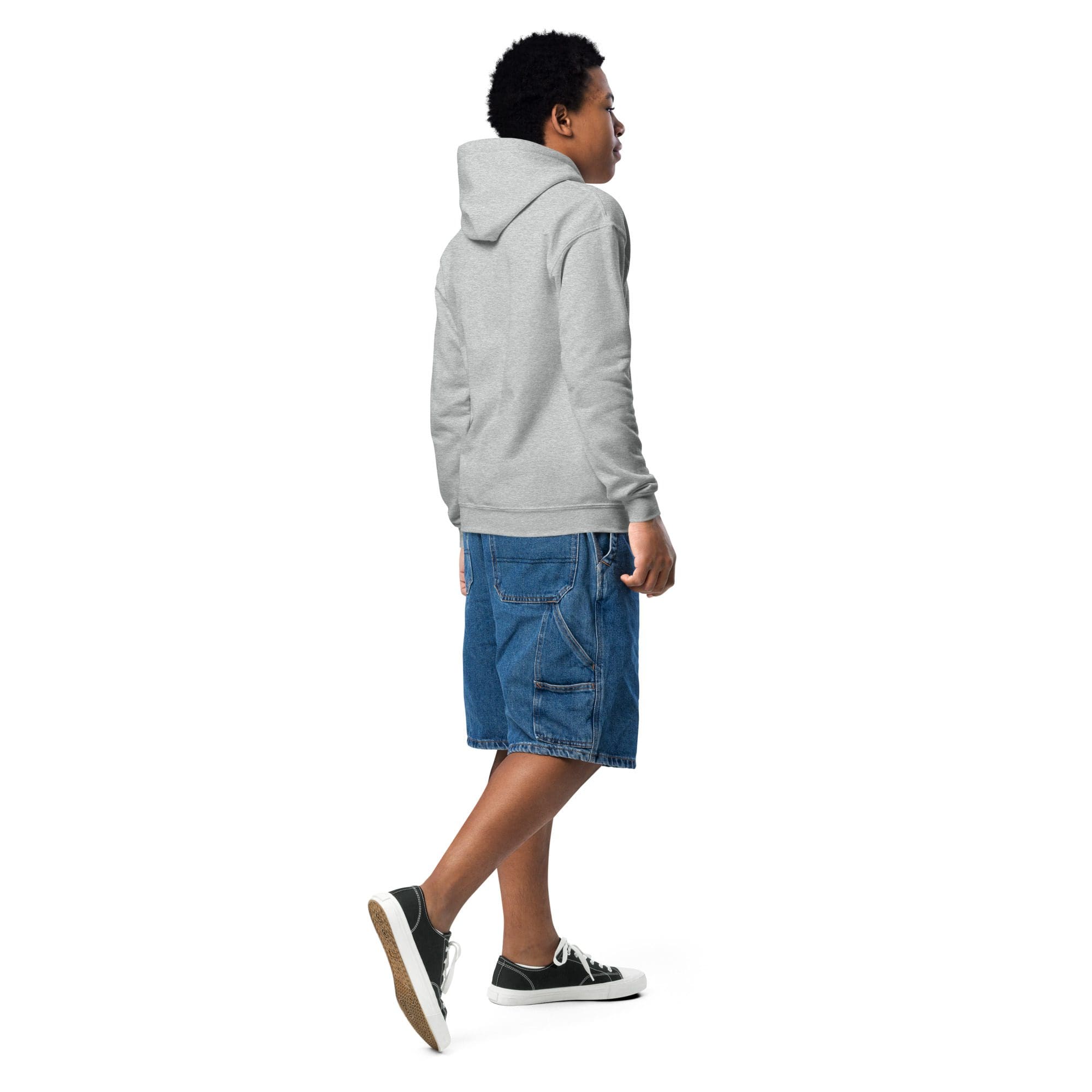Person in gray hoodie and denim shorts.