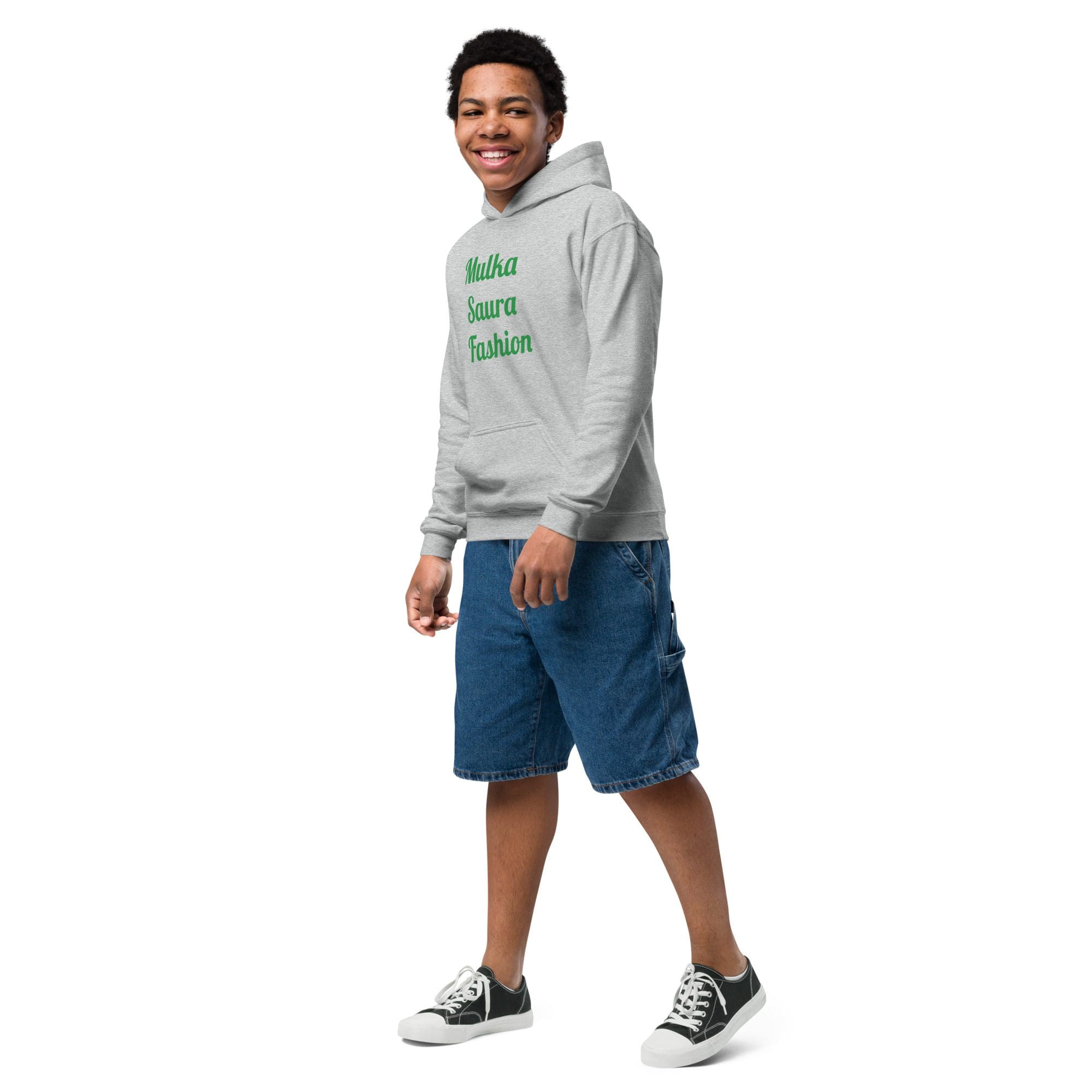 Teen in grey hoodie and denim shorts.