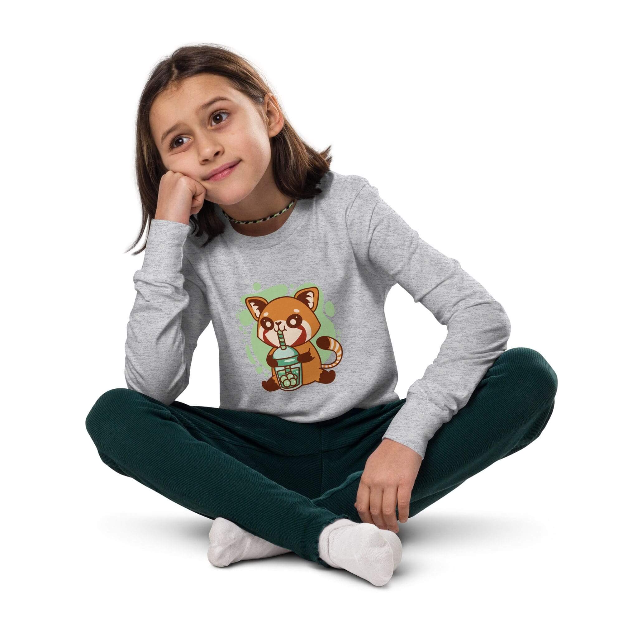 Child sitting with red panda shirt.