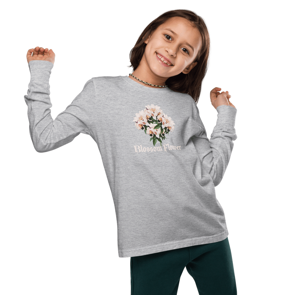 Child posing in gray floral sweatshirt.