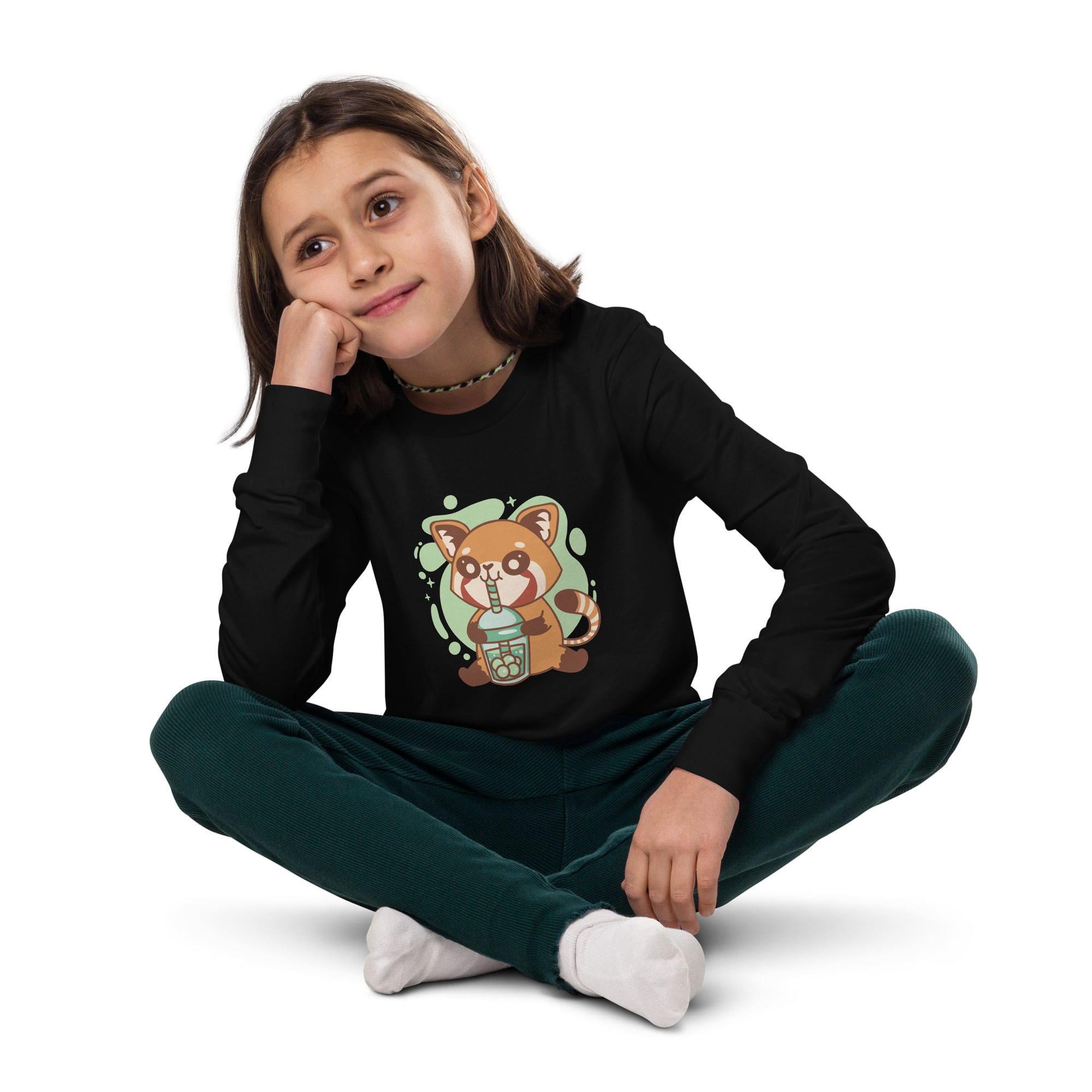 Girl sitting, wearing black shirt, thoughtful expression.
