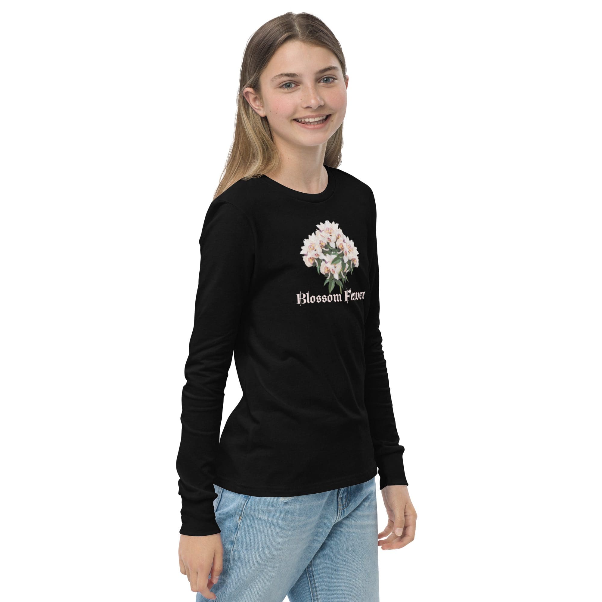 Smiling person in black floral long-sleeve shirt.