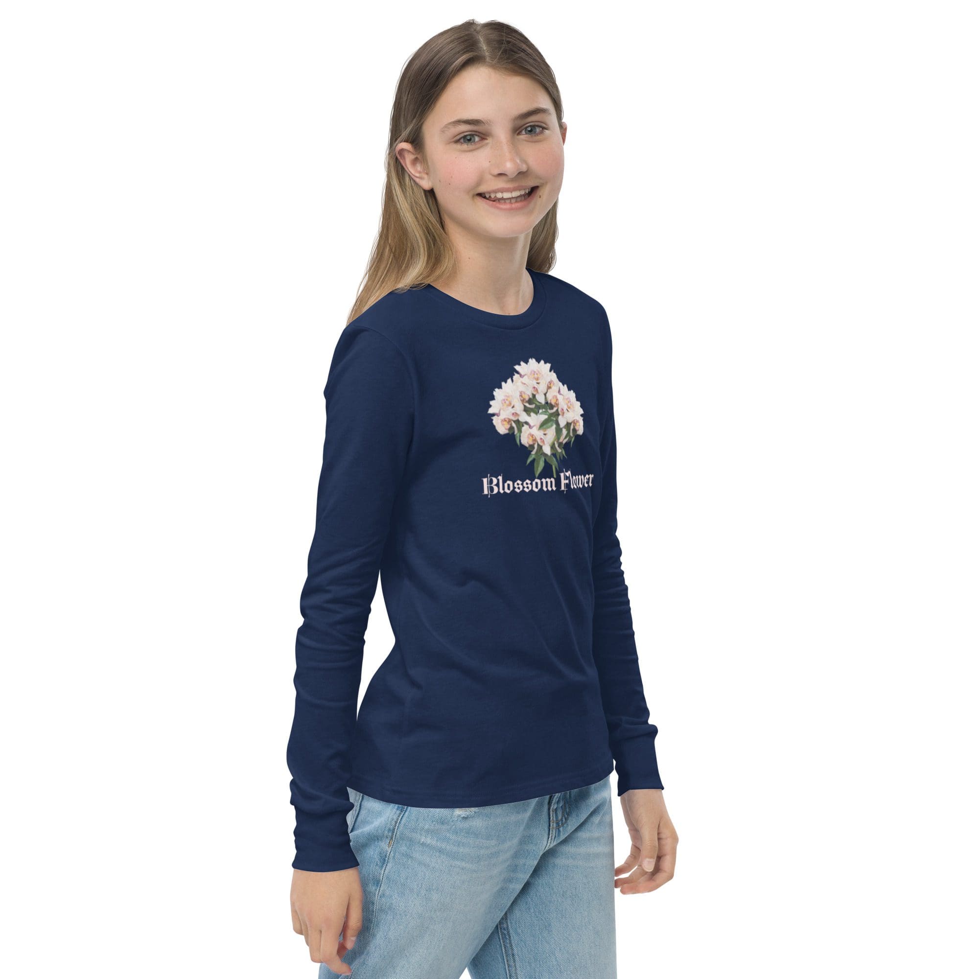 Smiling girl in blue floral print shirt.