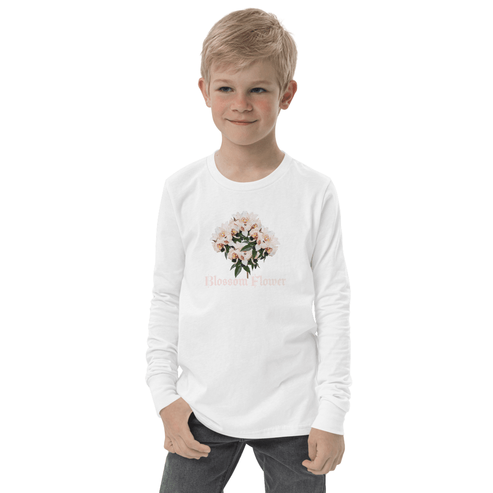 Boy wearing floral shirt, smiling confidently.