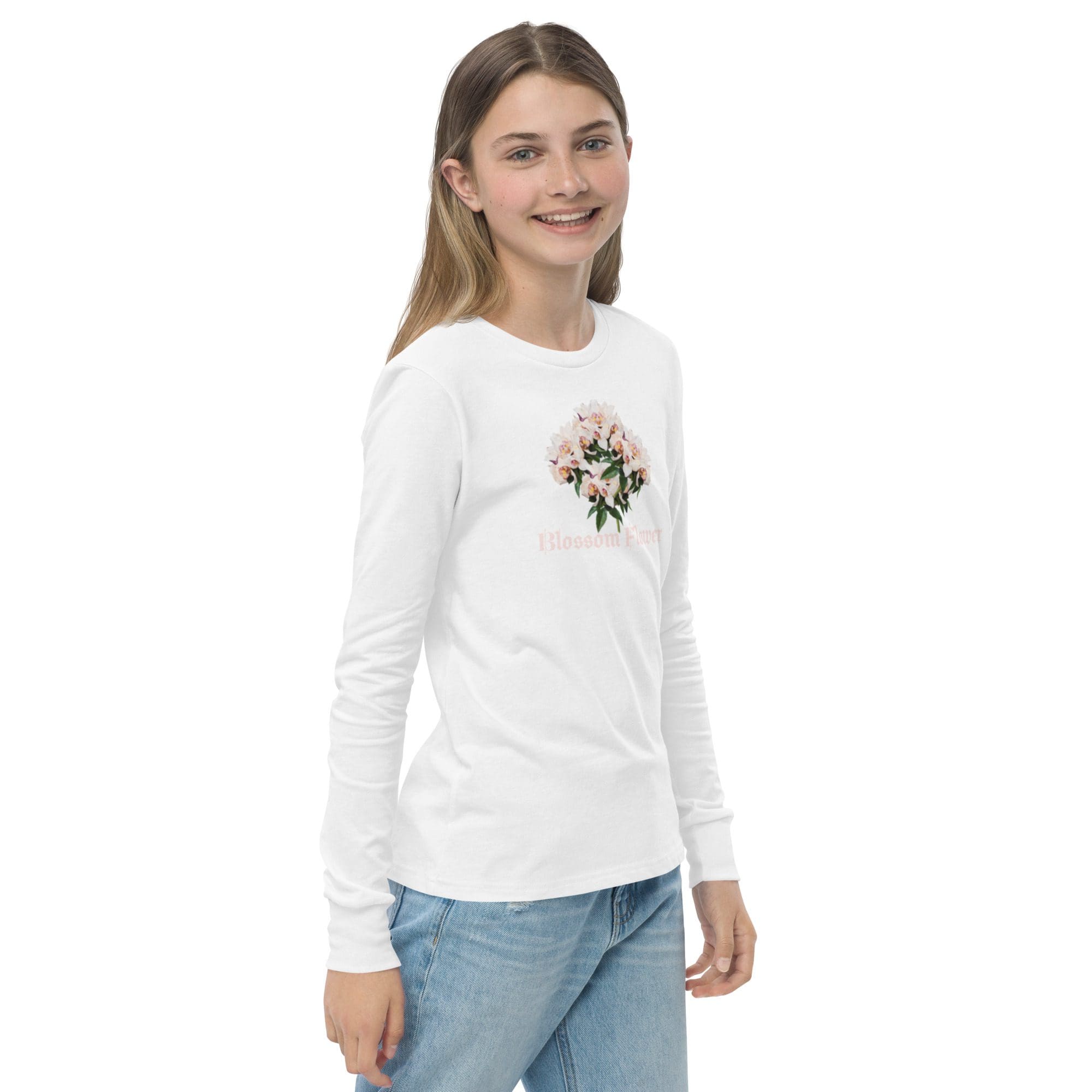 Smiling girl in floral shirt and jeans.