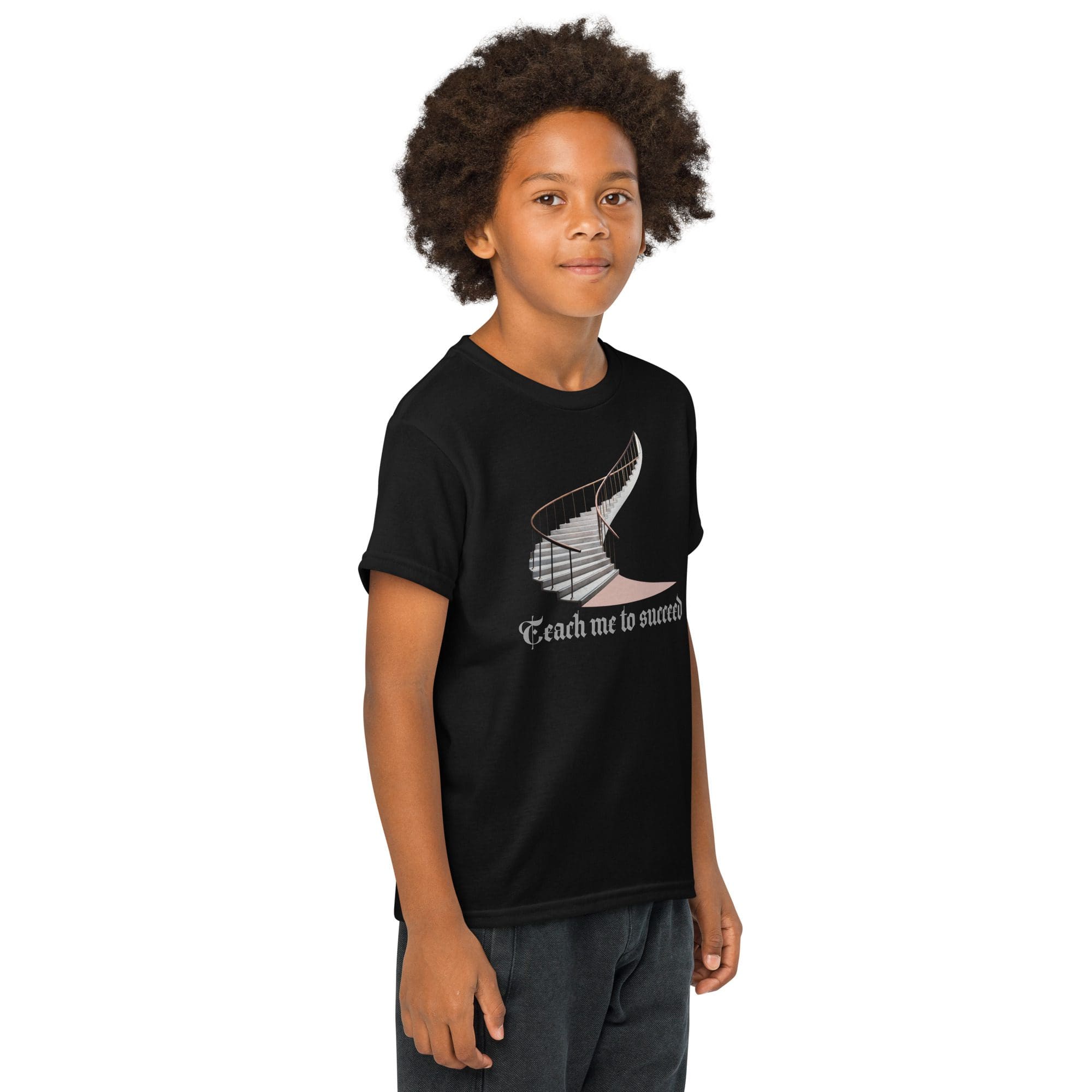 Child wearing black printed t-shirt smiling.