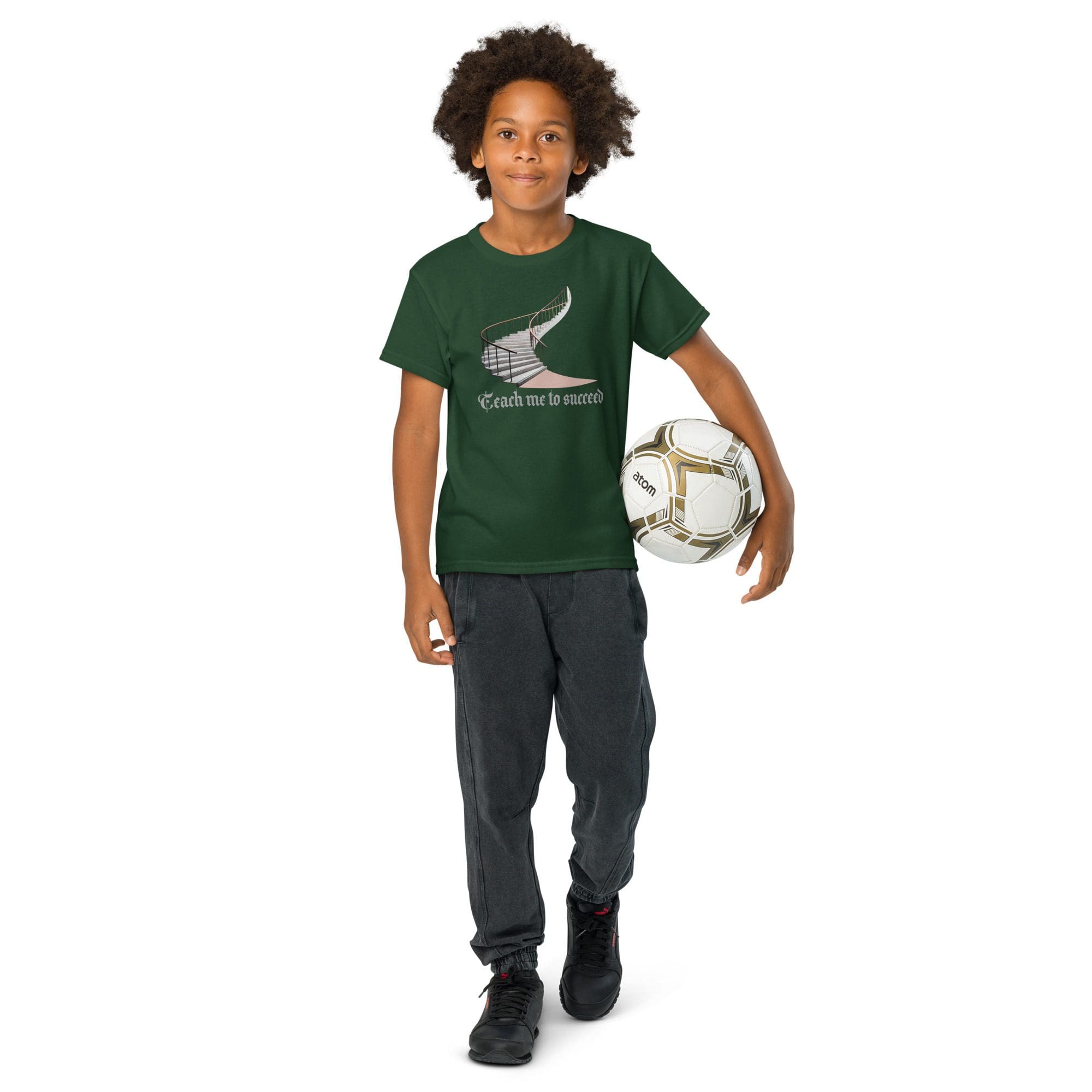 Child holding a soccer ball, smiling confidently.